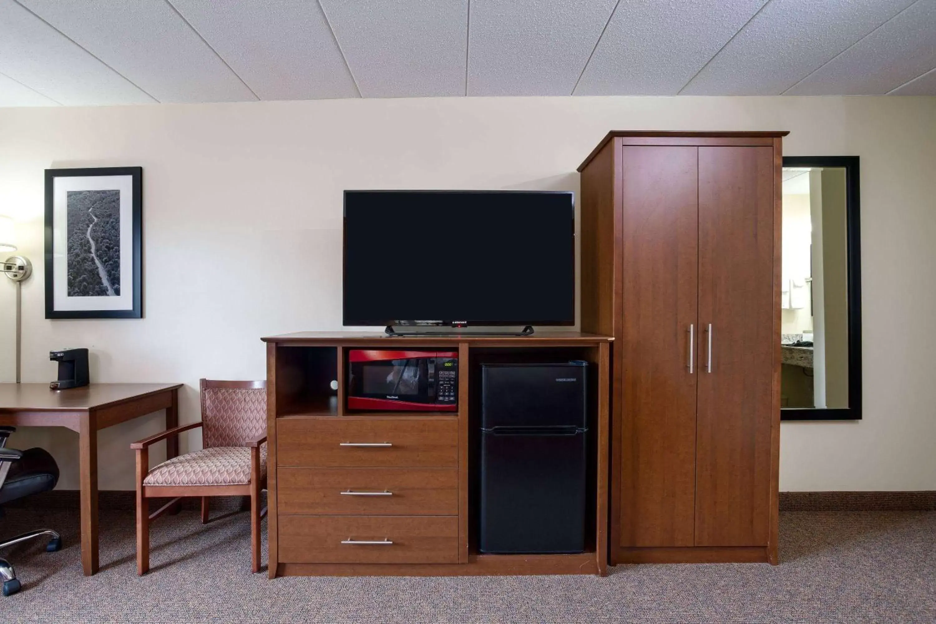Photo of the whole room, TV/Entertainment Center in AmericInn by Wyndham Tomah
