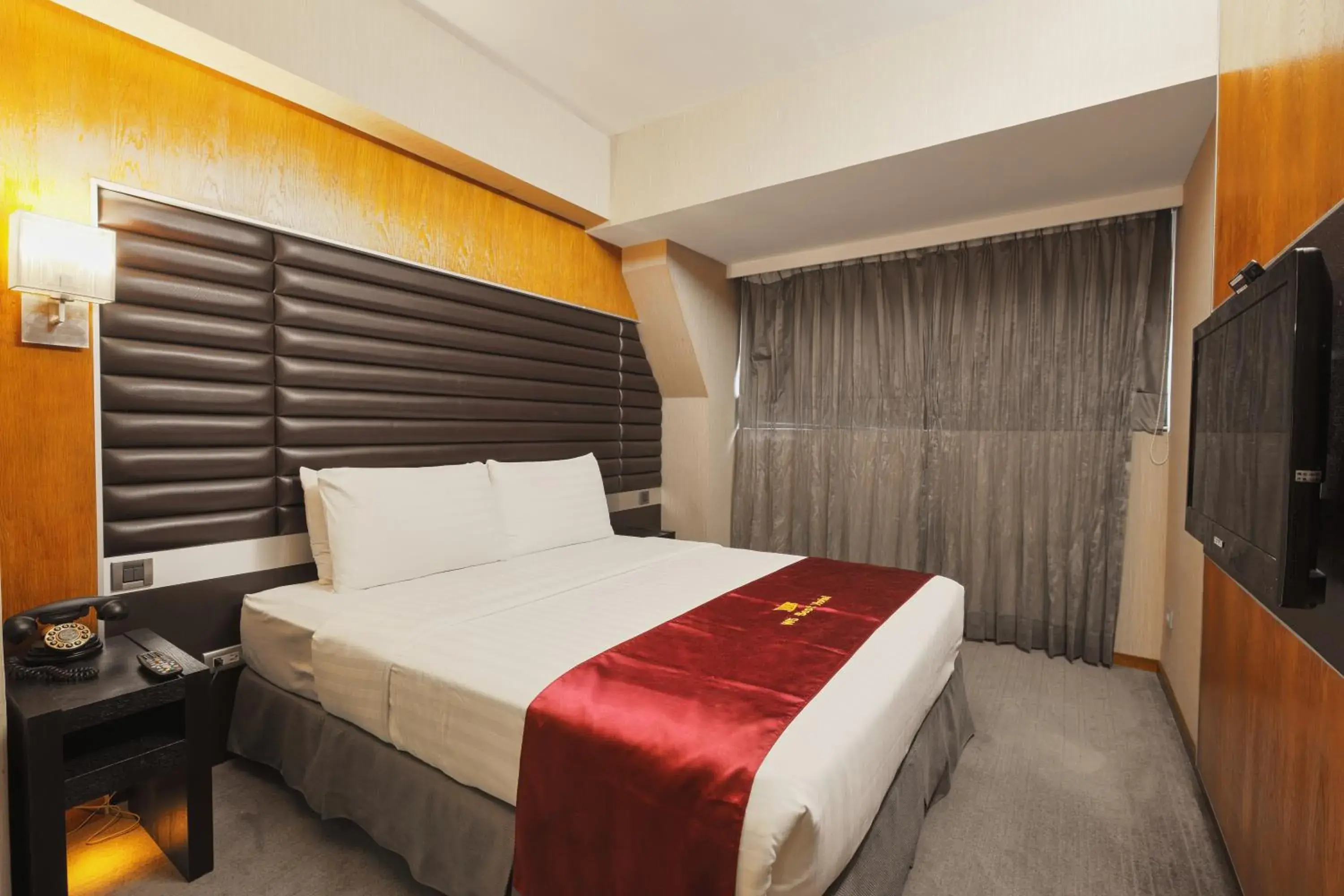 Bed in Li Duo Best Hotel