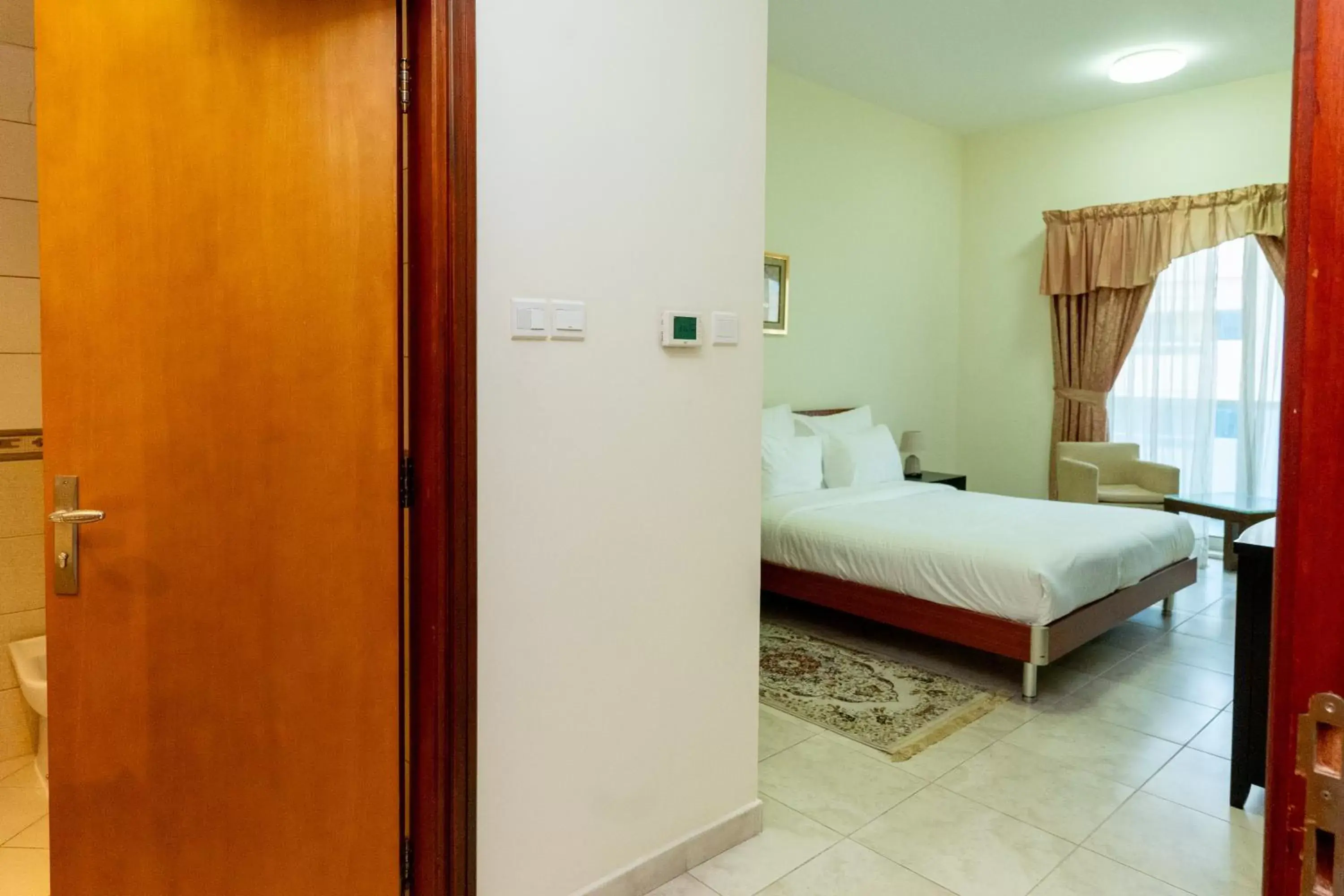 Bed in Al Raya Hotel Apartments
