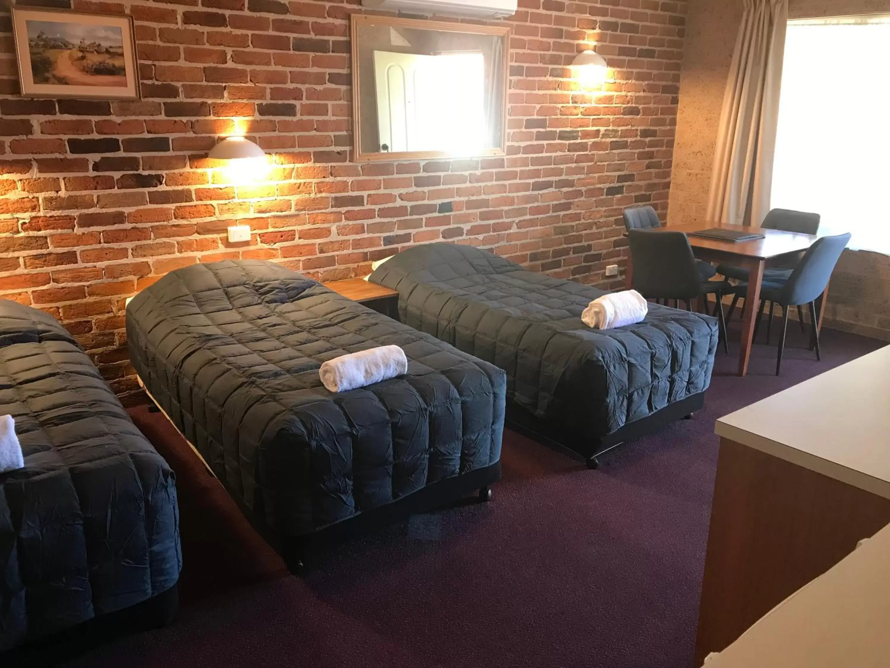 Bed in Cedar Lodge Motel