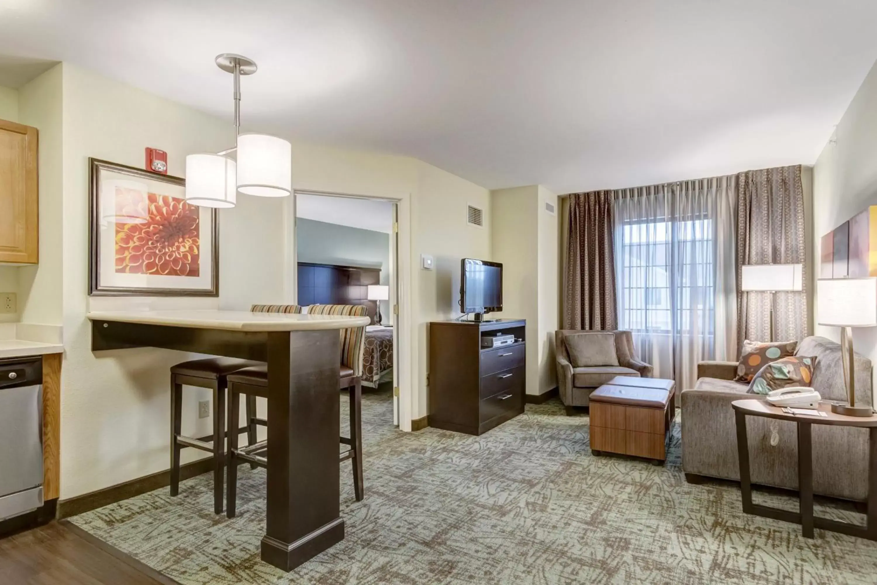 Photo of the whole room, TV/Entertainment Center in Staybridge Suites O'Fallon Chesterfield, an IHG Hotel