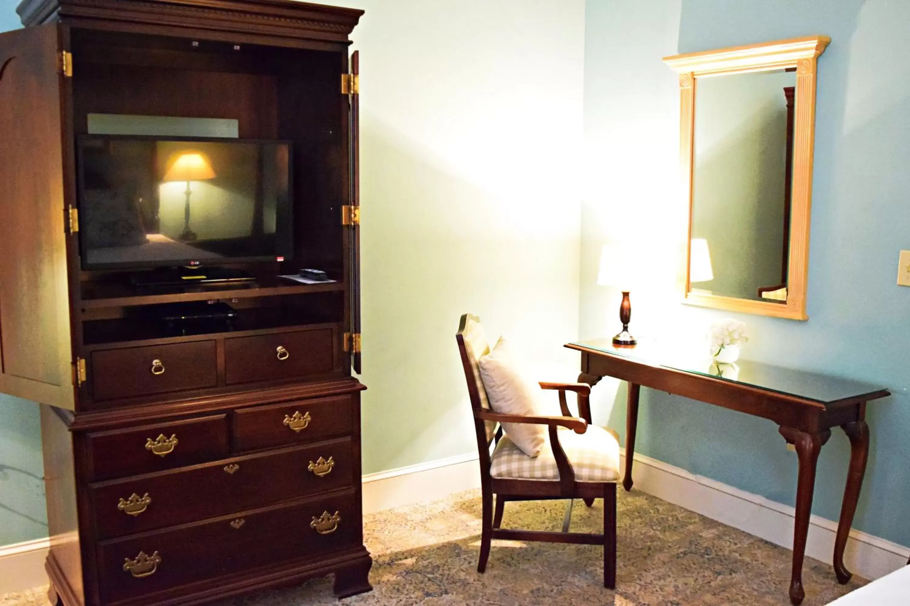 Seating area, TV/Entertainment Center in JH Adams Inn, Trademark Collection by Wyndham