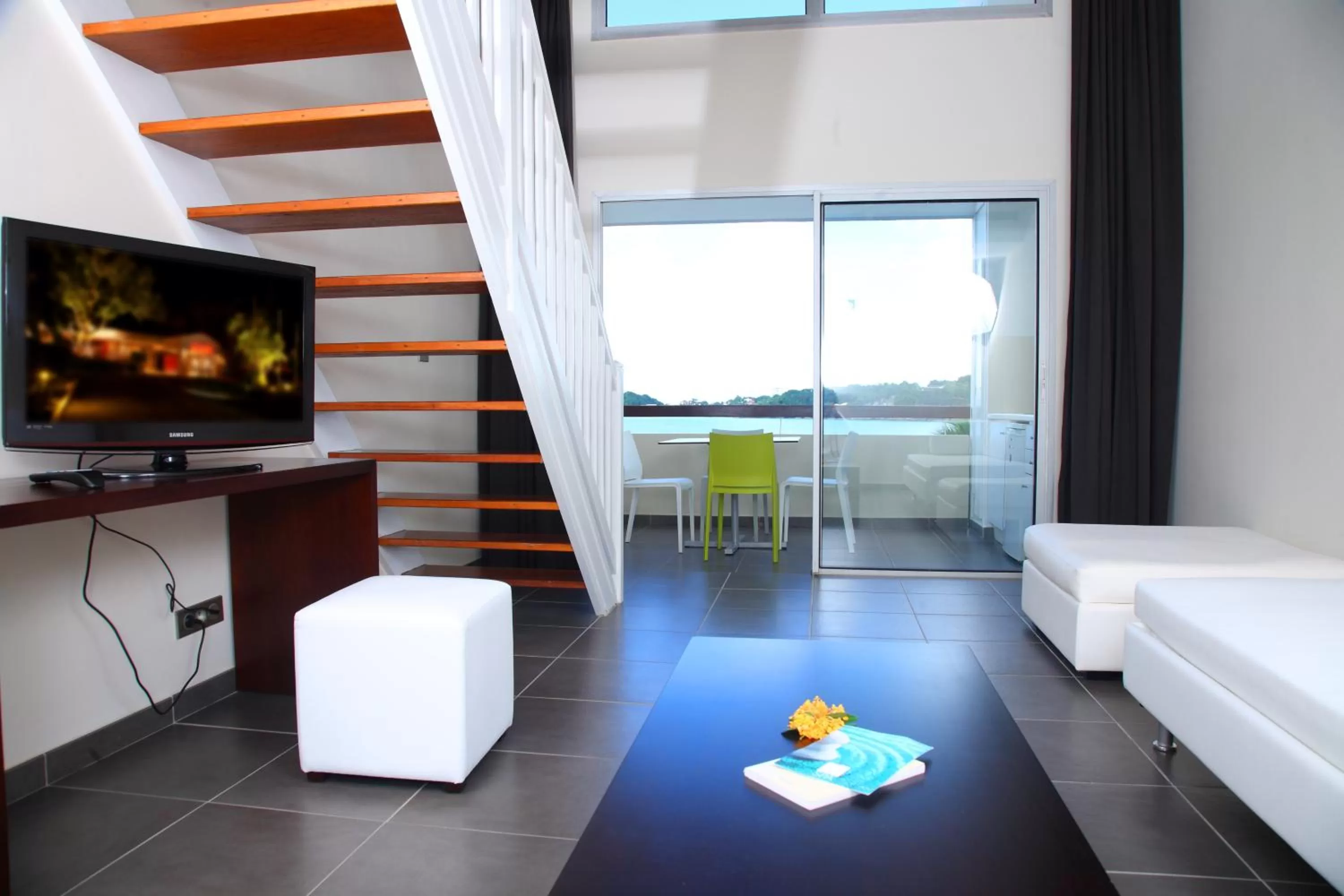 Communal lounge/ TV room, Bed in Mahogany Hotel Residence & Spa