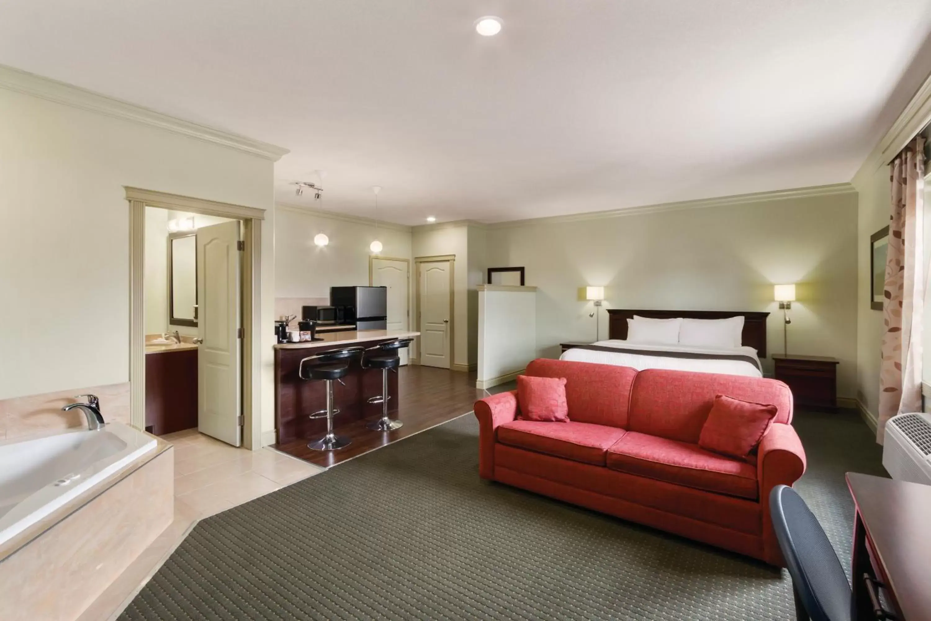 Bedroom, Seating Area in Quality Inn & Suites