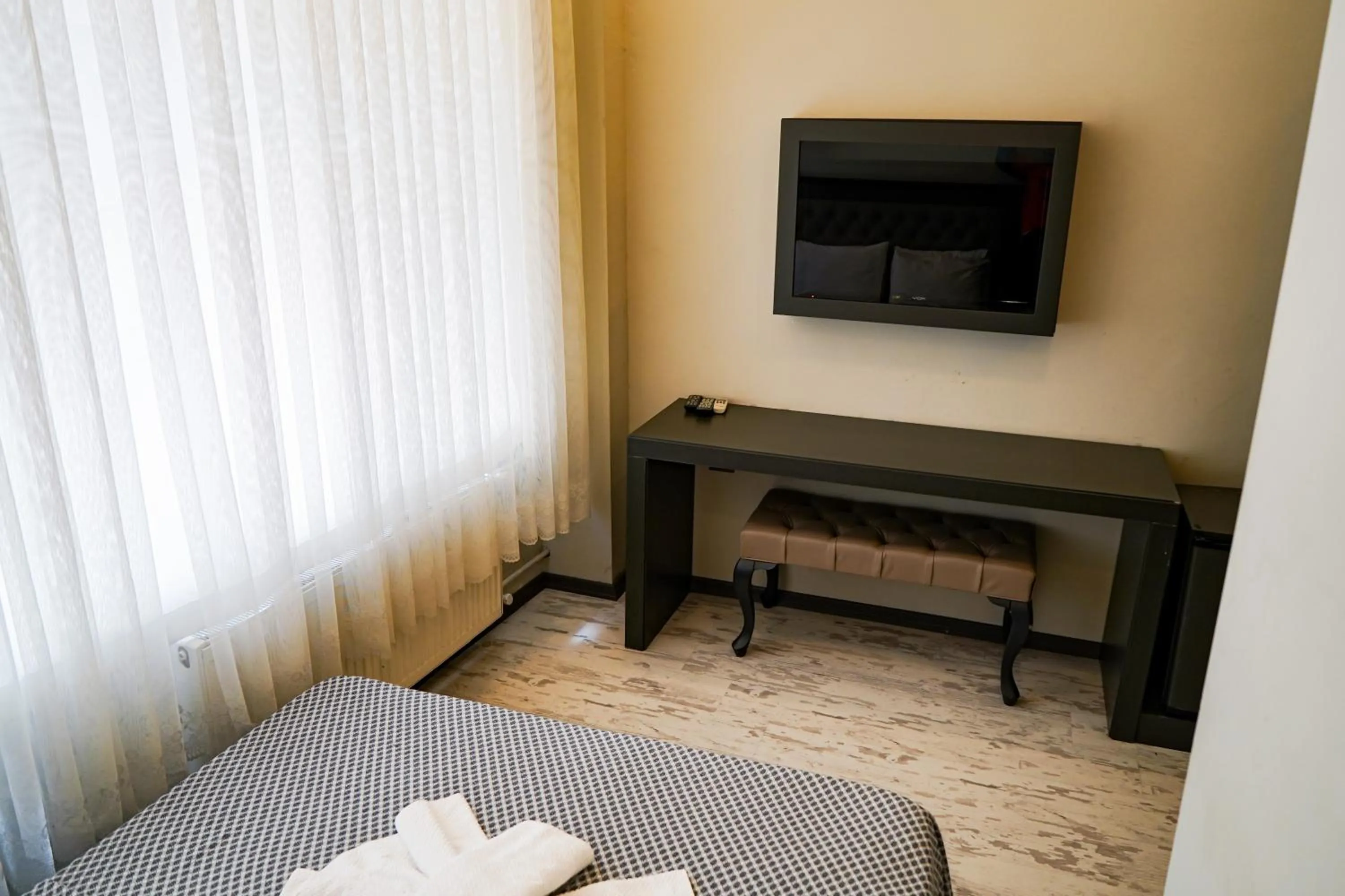 Photo of the whole room, TV/Entertainment Center in Paradise Hotel