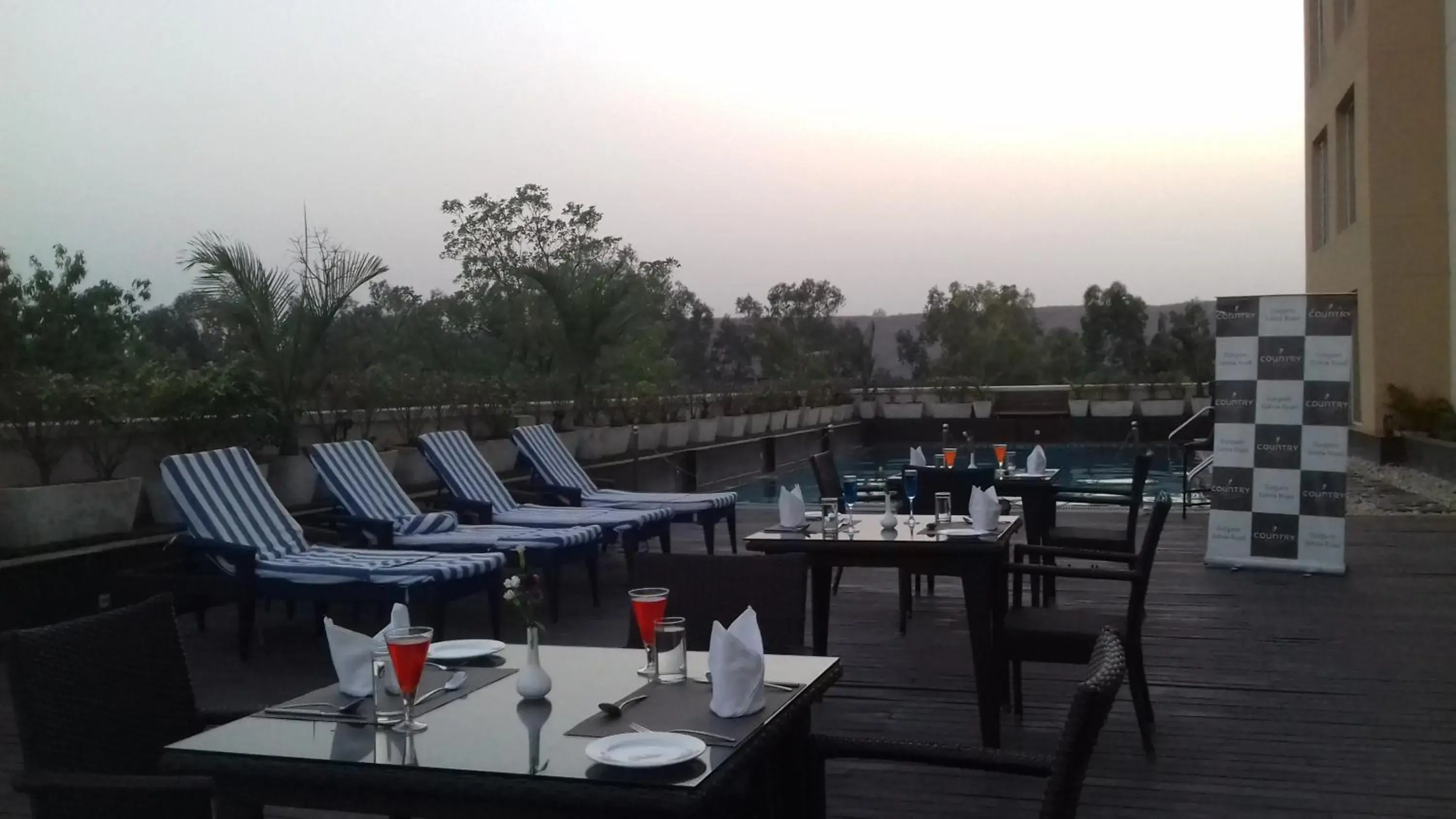 Swimming pool, Restaurant/Places to Eat in Country Inn & Suites by Radisson, Gurugram Sohna Road