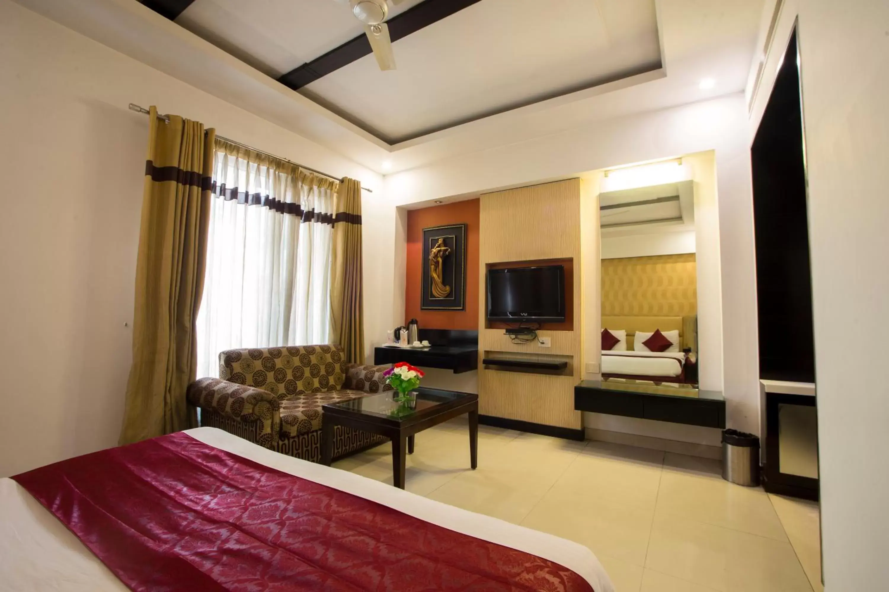 Bedroom, Seating Area in Hotel Krishna - By RCG Hotels