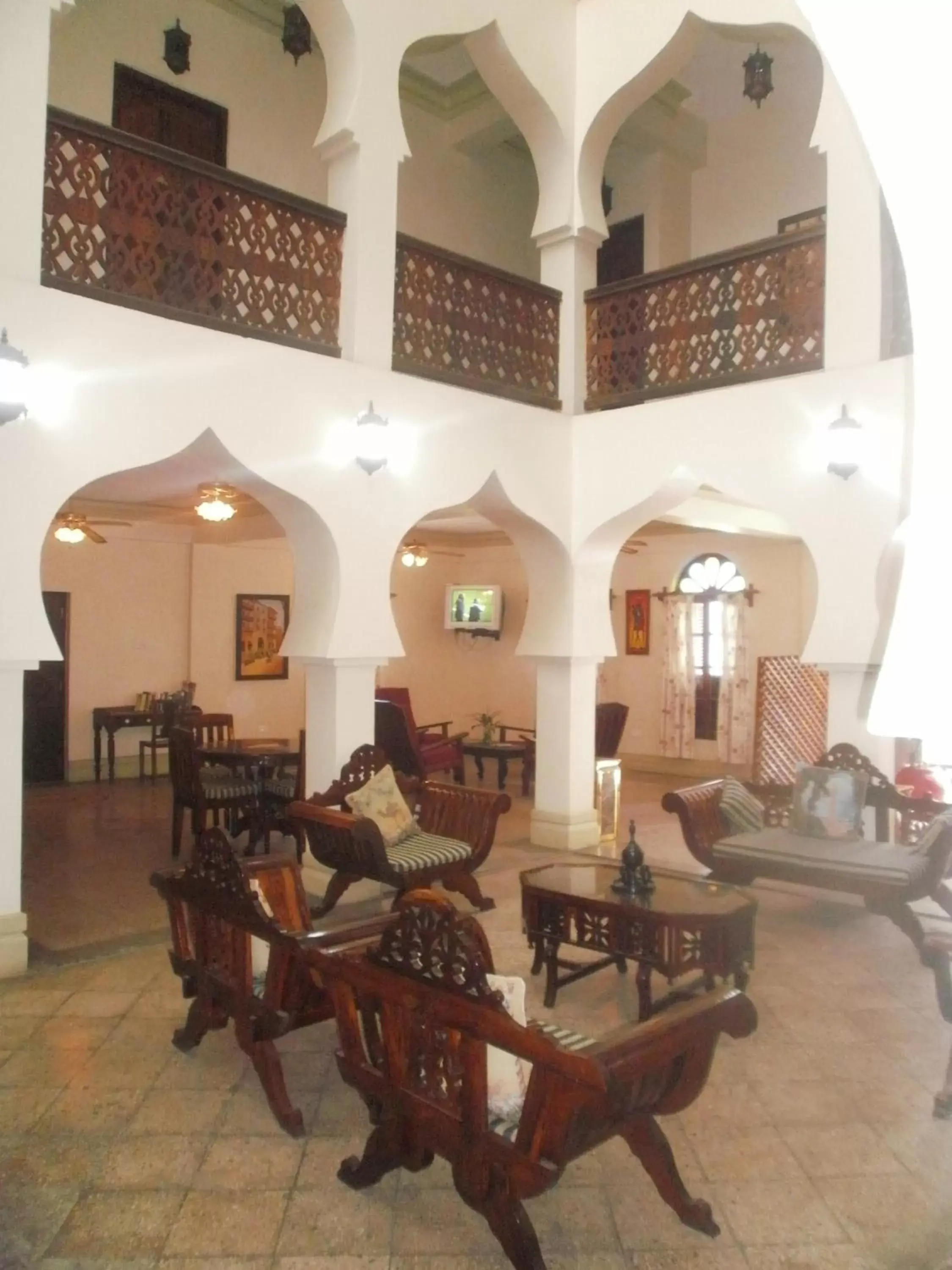 Communal lounge/ TV room in Asmini Palace Hotel