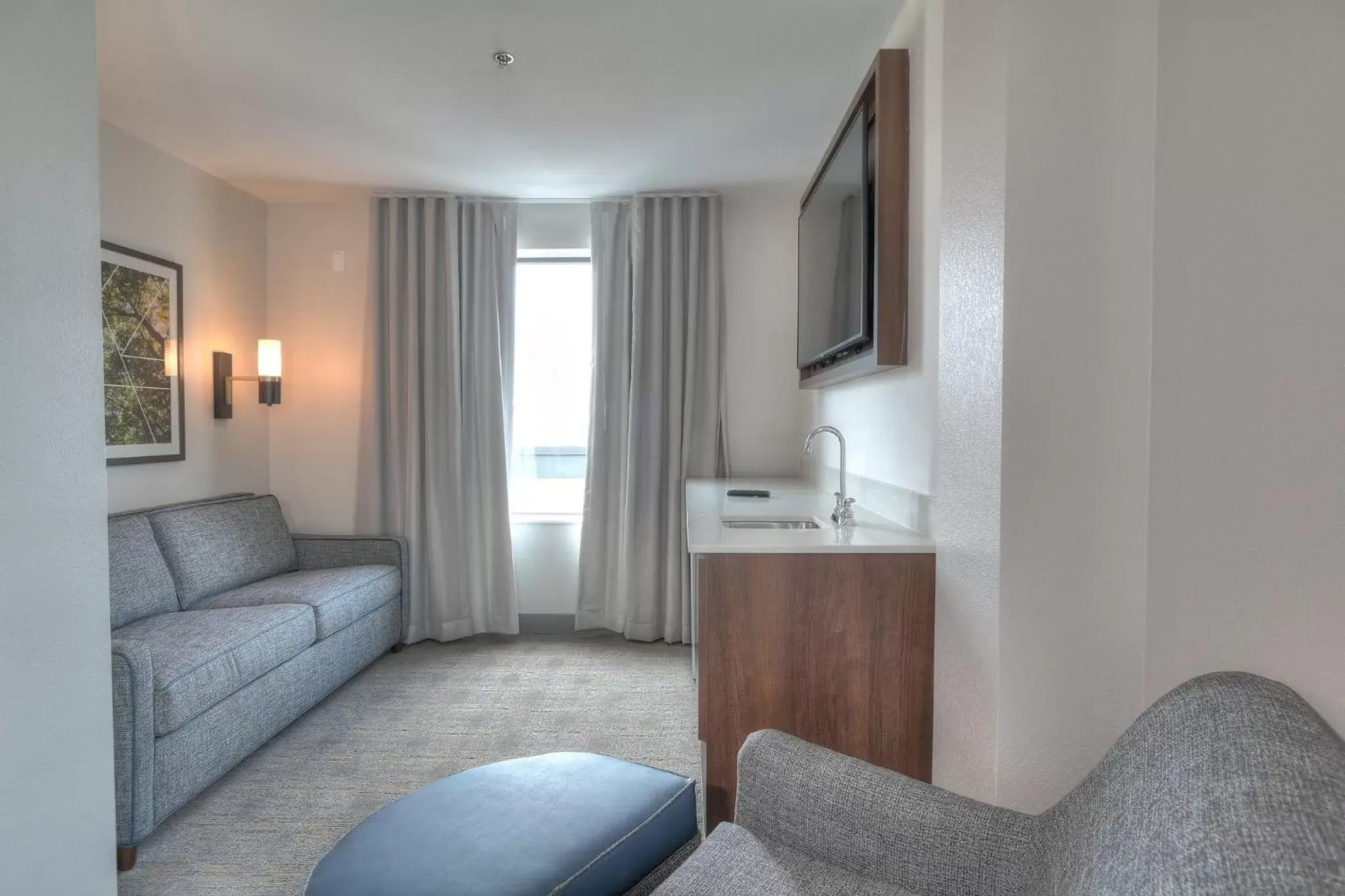 Bedroom, Seating Area in Holiday Inn & Suites Pigeon Forge Convention Center, an IHG Hotel