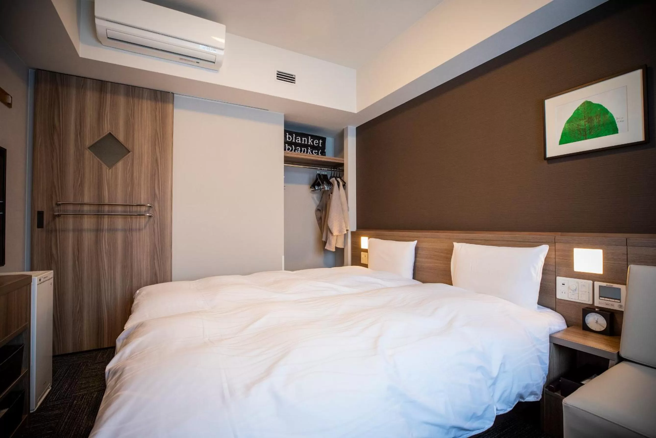 Photo of the whole room, Bed in La Vista Furano Hills Natural Hot Spring