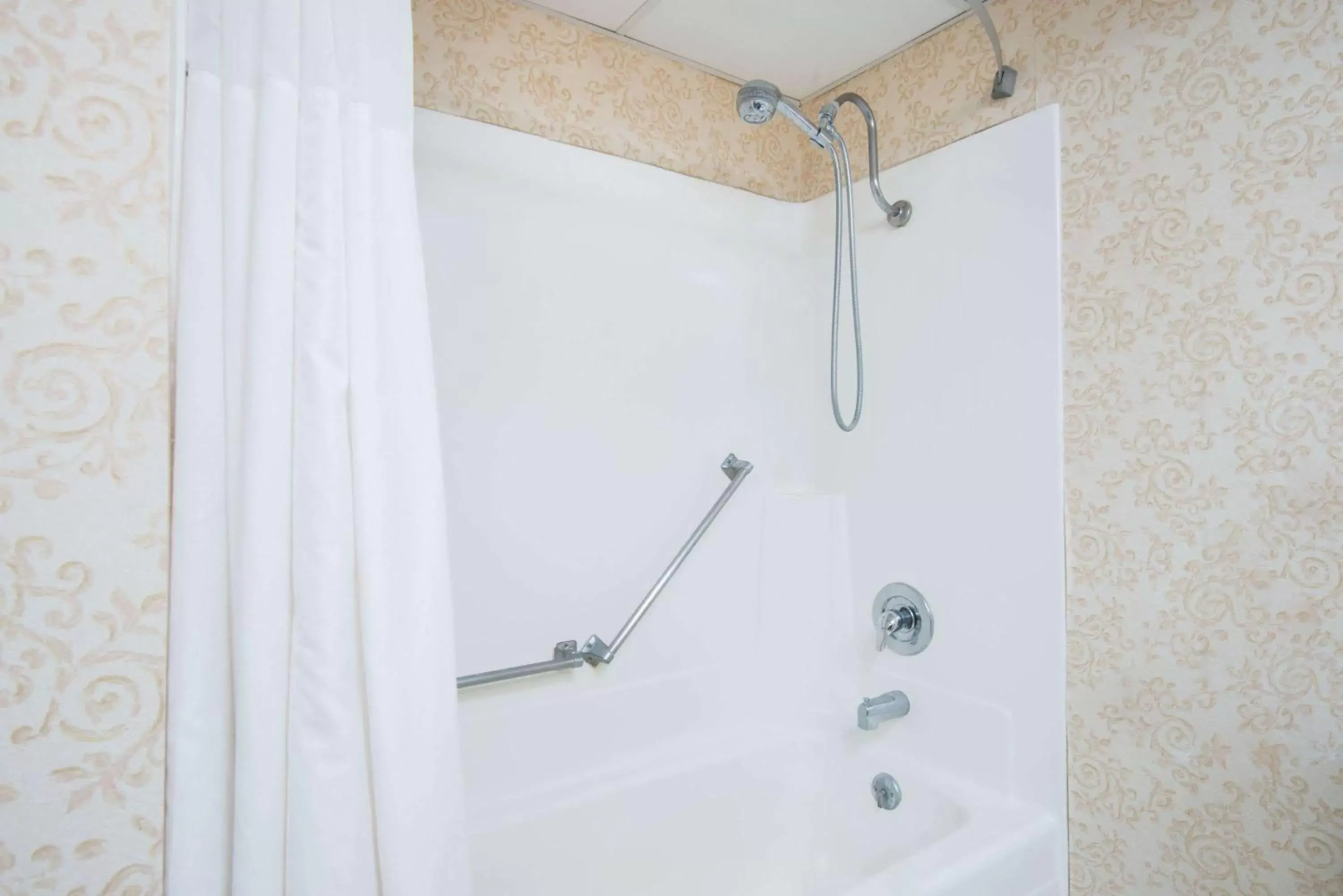 Bathroom in Ramada Plaza by Wyndham Gillette Conference Center