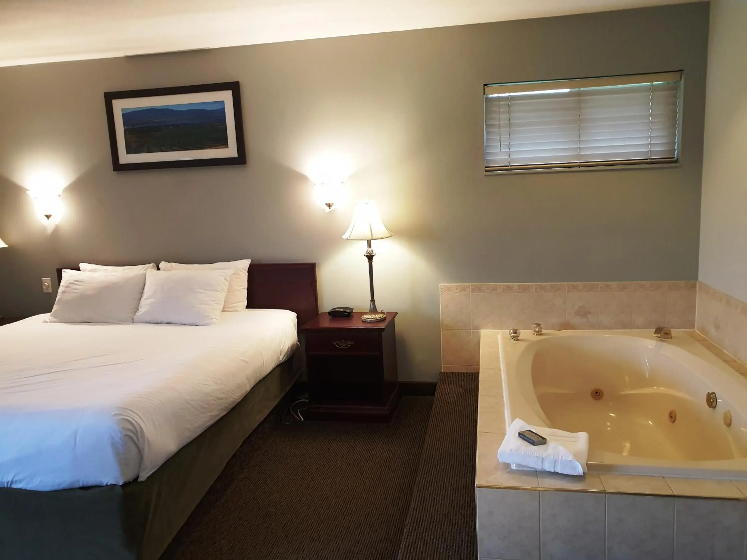 Bed in Riverland Inn & Suites