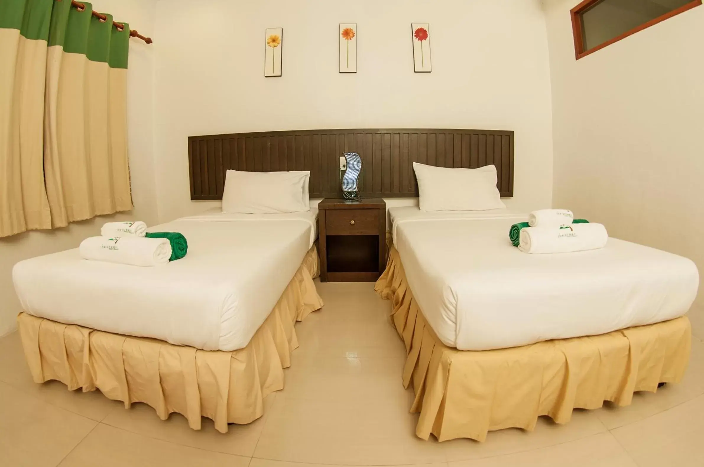 Bed in The Green Beach Resort