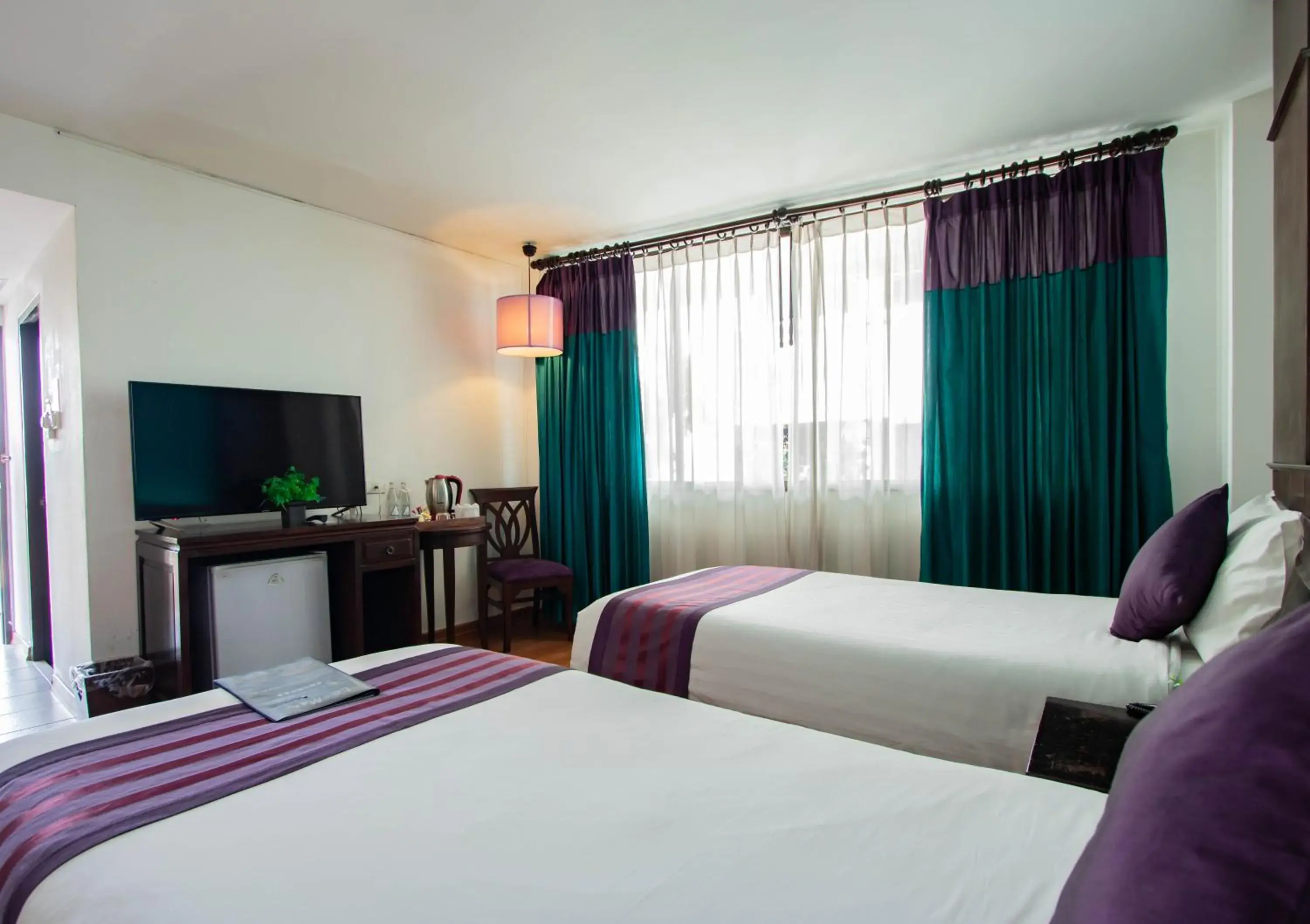 Bed in Eurana Boutique Hotel