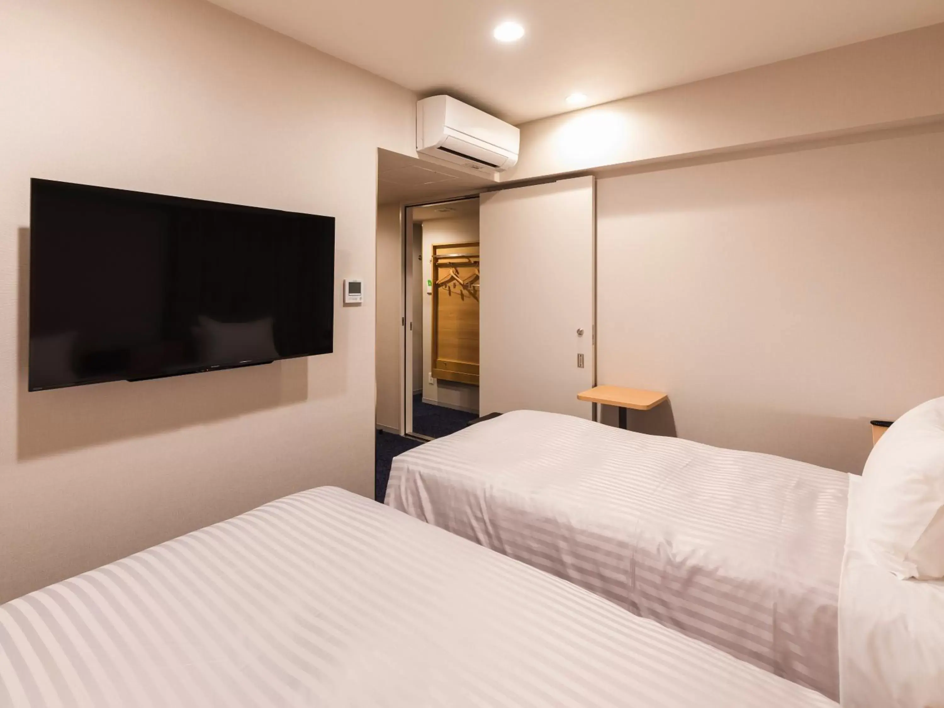 Photo of the whole room, Bed in Sotetsu Fresa Inn Nagoya-Shinkansenguchi