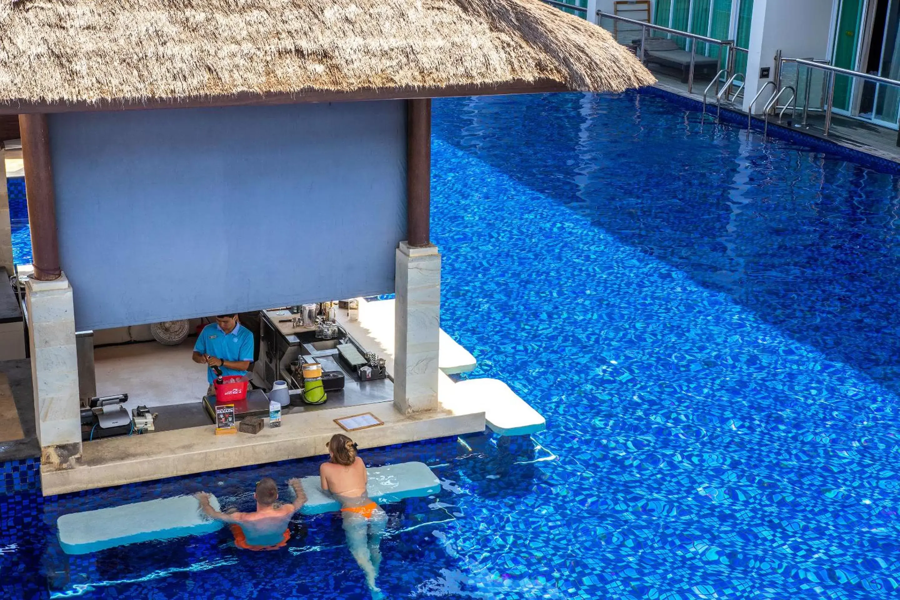 Lounge or bar, Swimming Pool in The Sakala Resort Bali All Suites CHSE Certified