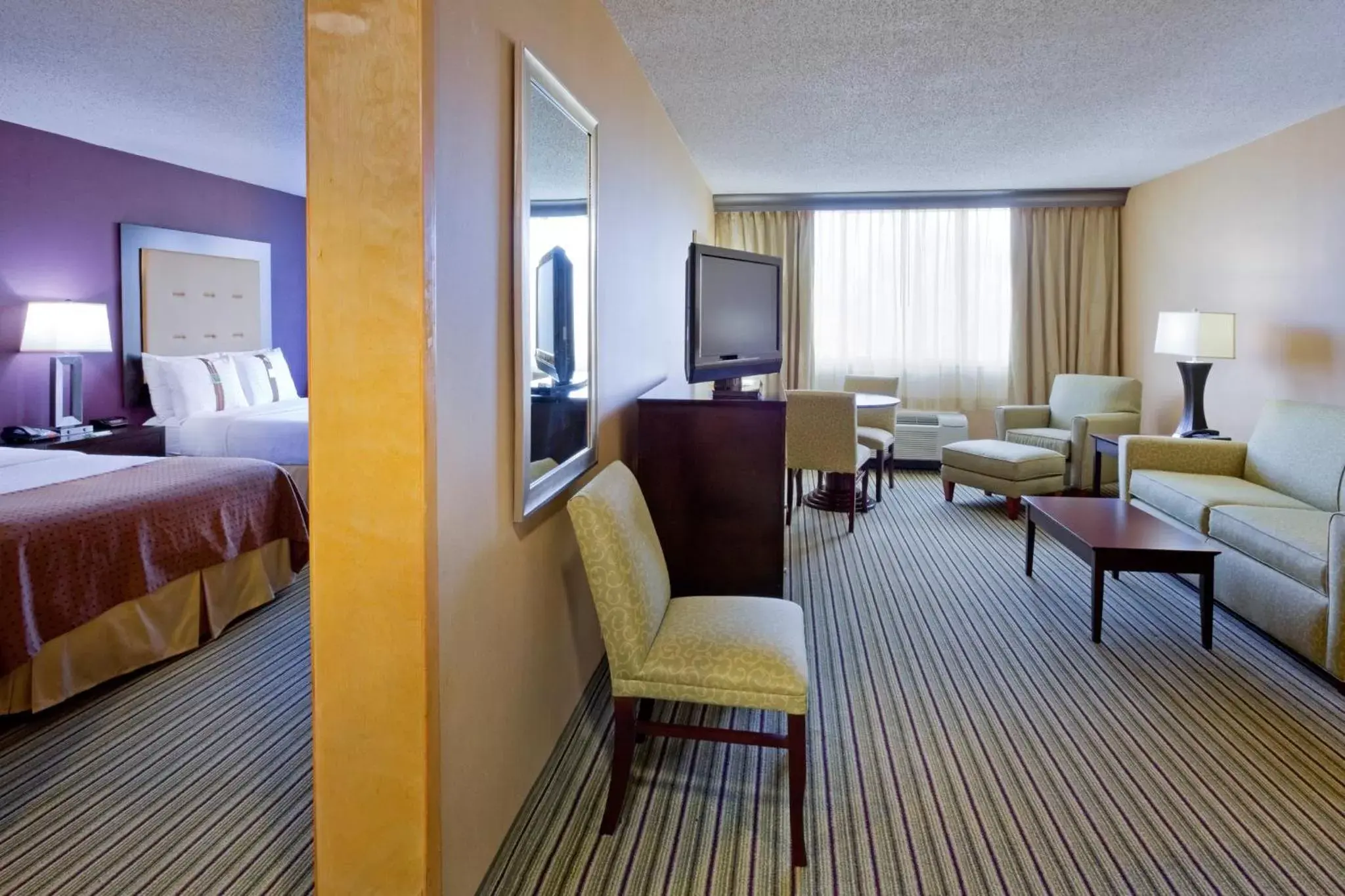 Bedroom, Seating Area in Holiday Inn & Suites Parsippany Fairfield, an IHG Hotel