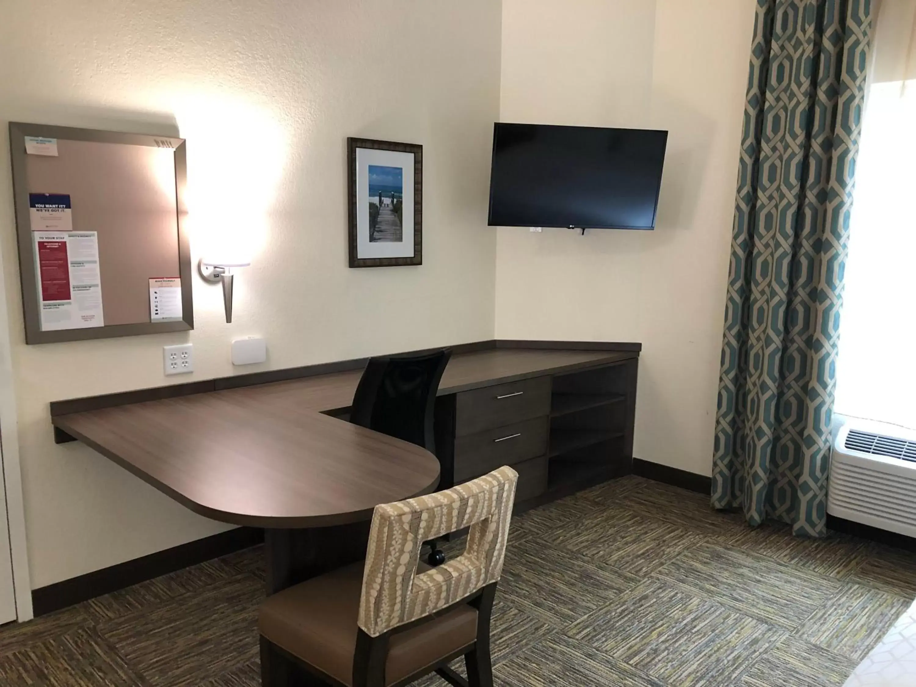 Photo of the whole room, TV/Entertainment Center in Candlewood Suites - Panama City Beach Pier Park, an IHG Hotel