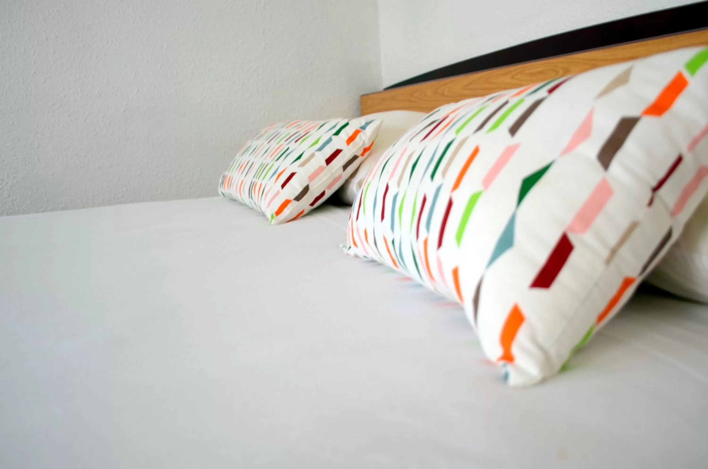 Decorative detail, Bed in initial by balladins La Roche-sur-Yon