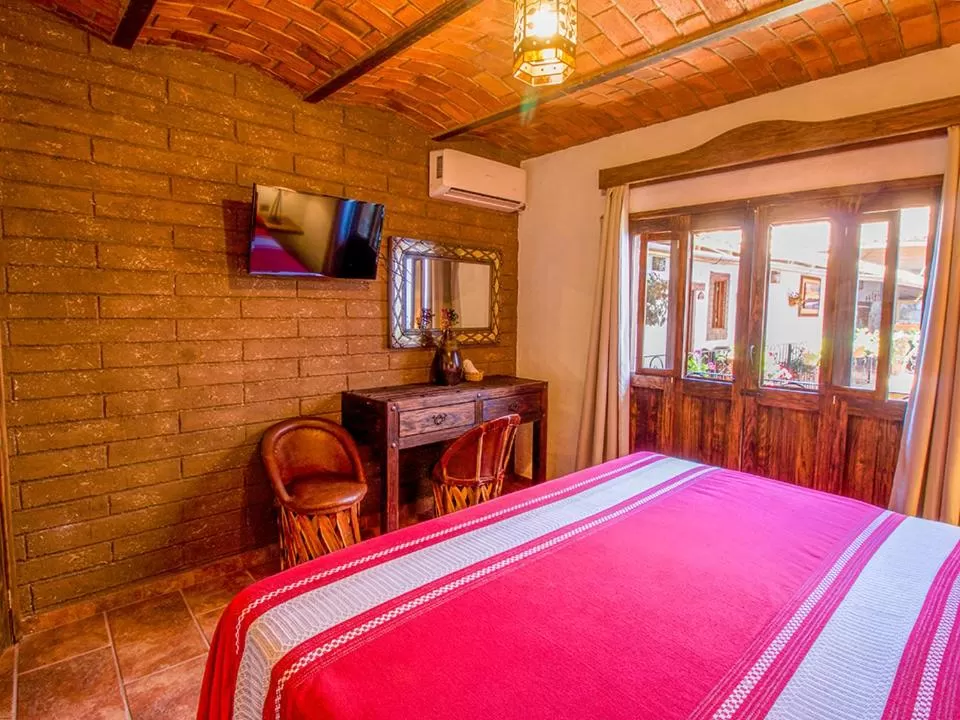 Photo of the whole room, Bed in Hotel Mi Pueblito Tapalpa