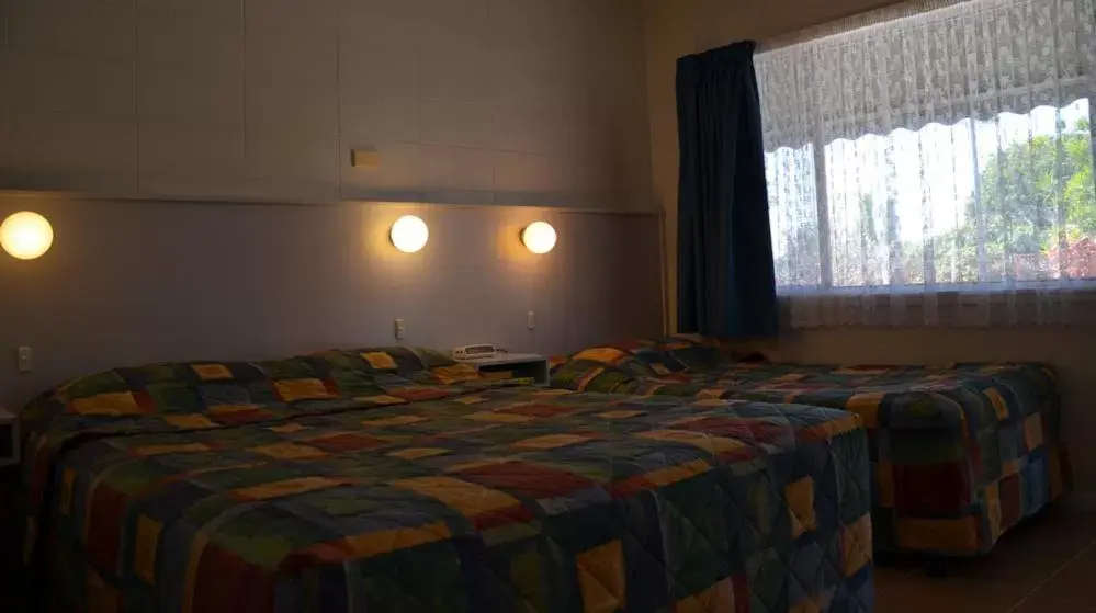 Bed in Tweed River Motel
