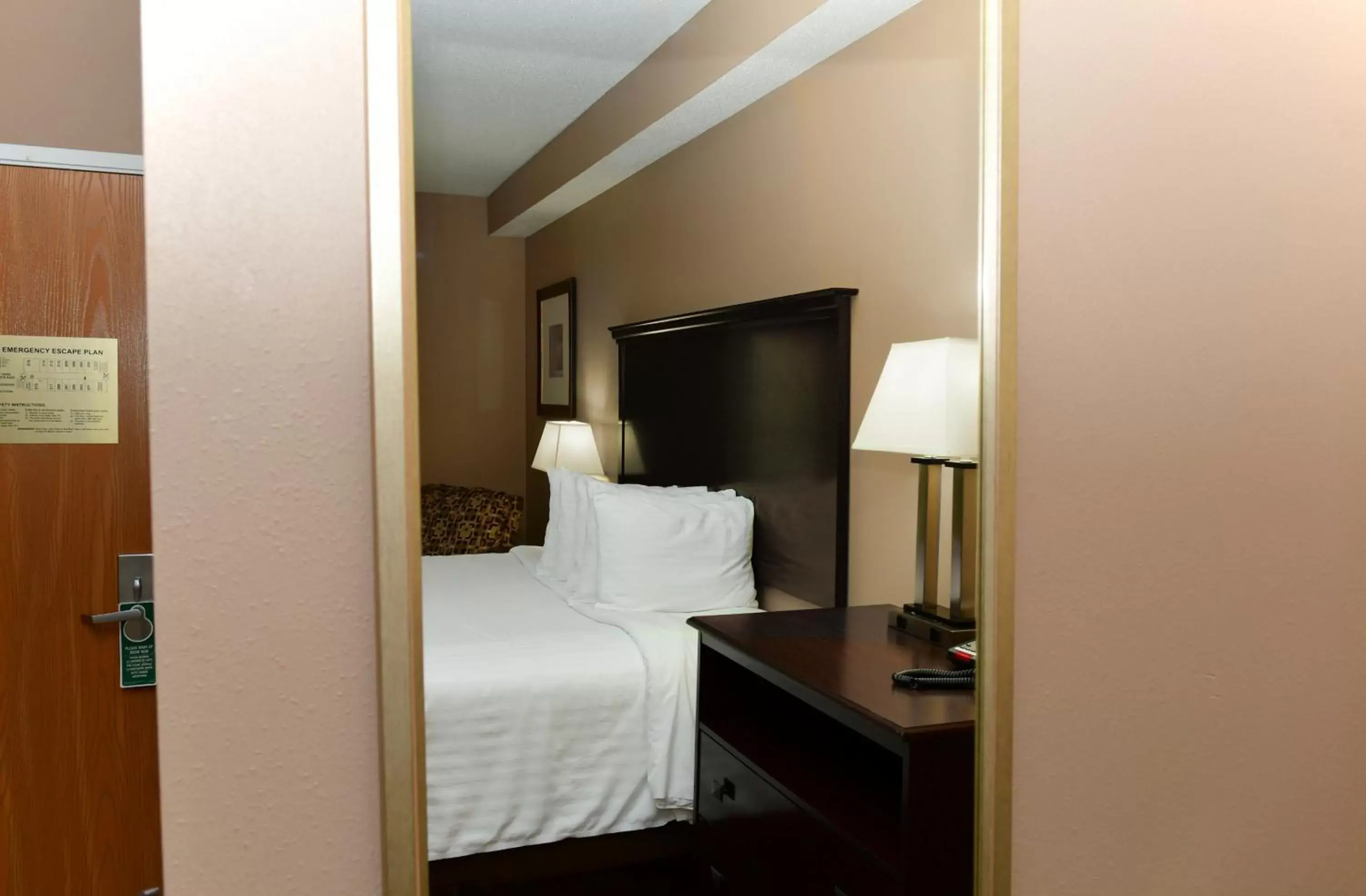 Bed in Cobblestone Inn & Suites - Denison | Majestic Hills