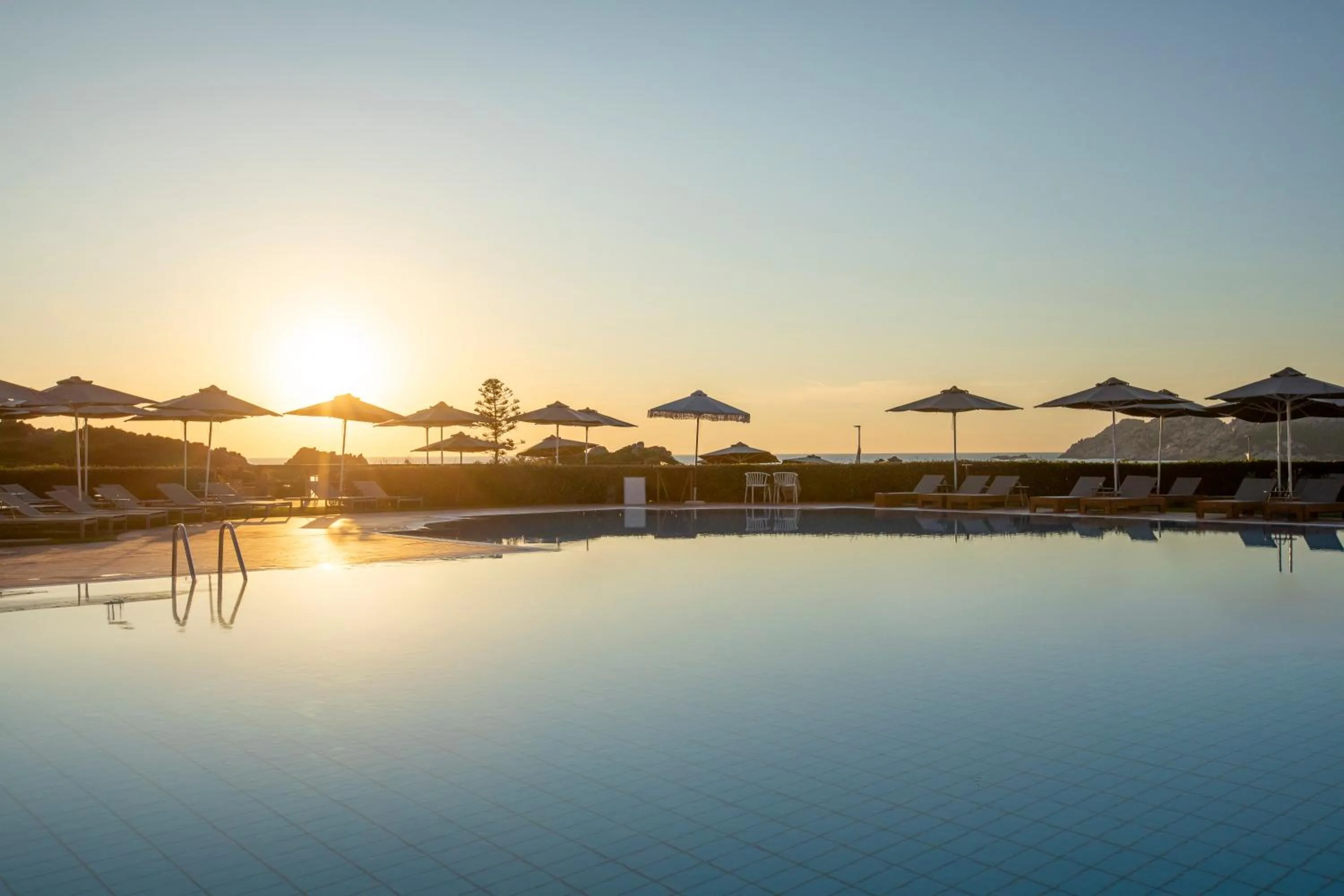 Swimming pool in Mangia's Santa Teresa Sardinia, Curio Collection by Hilton