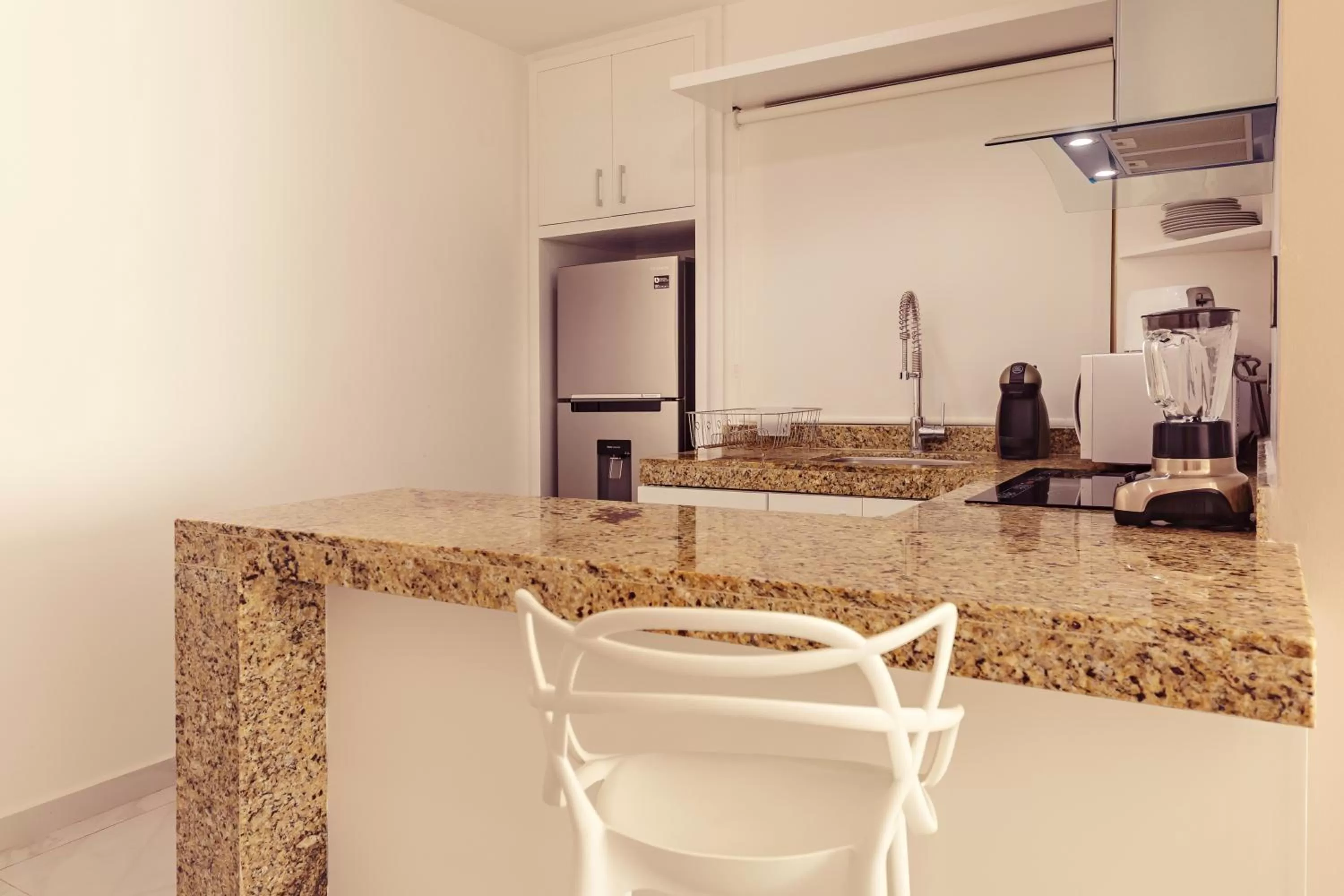 Kitchen or kitchenette in Mararena Condos by Nah Hotels
