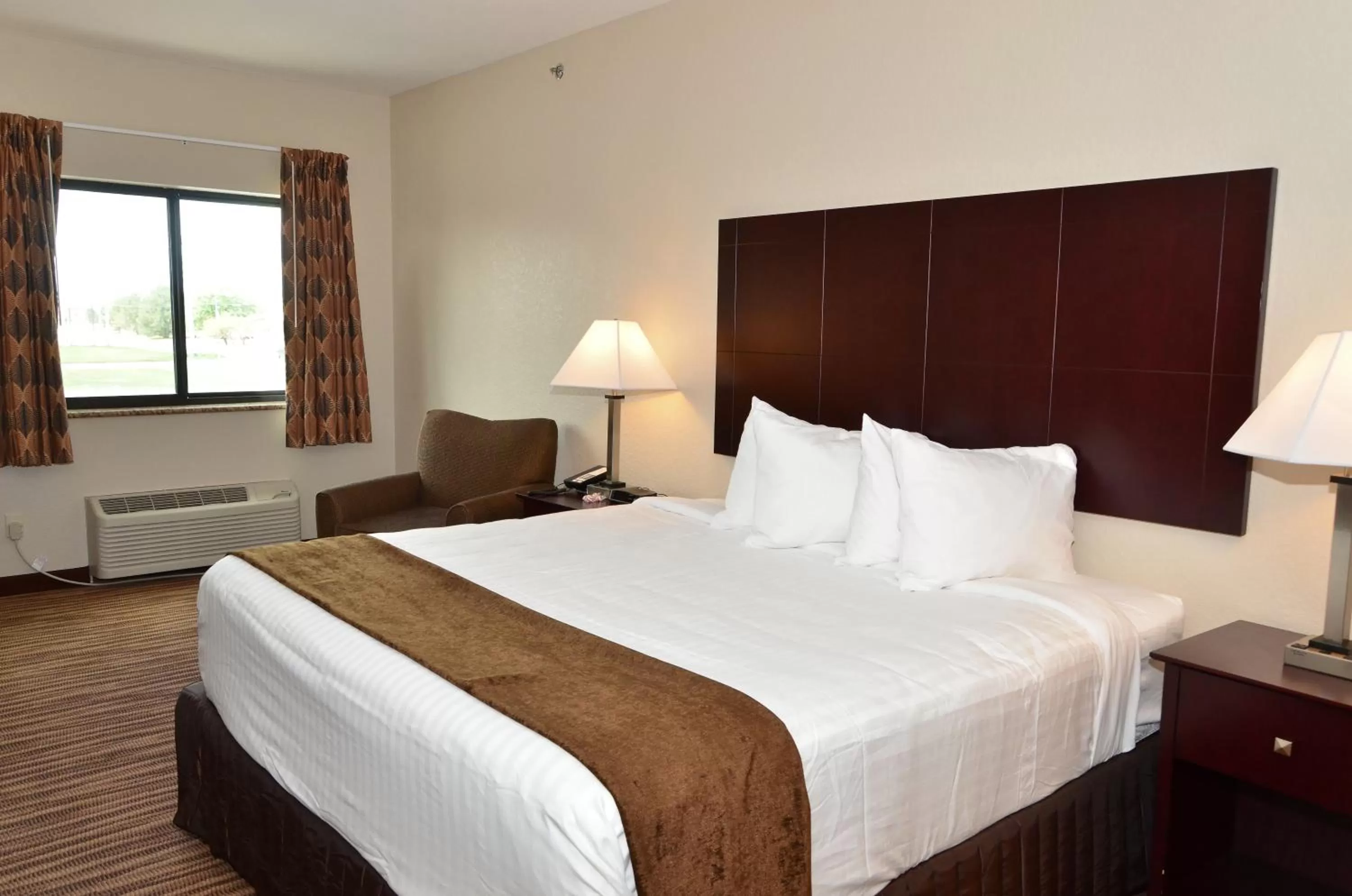 Bed in Cobblestone Inn & Suites - Clarion