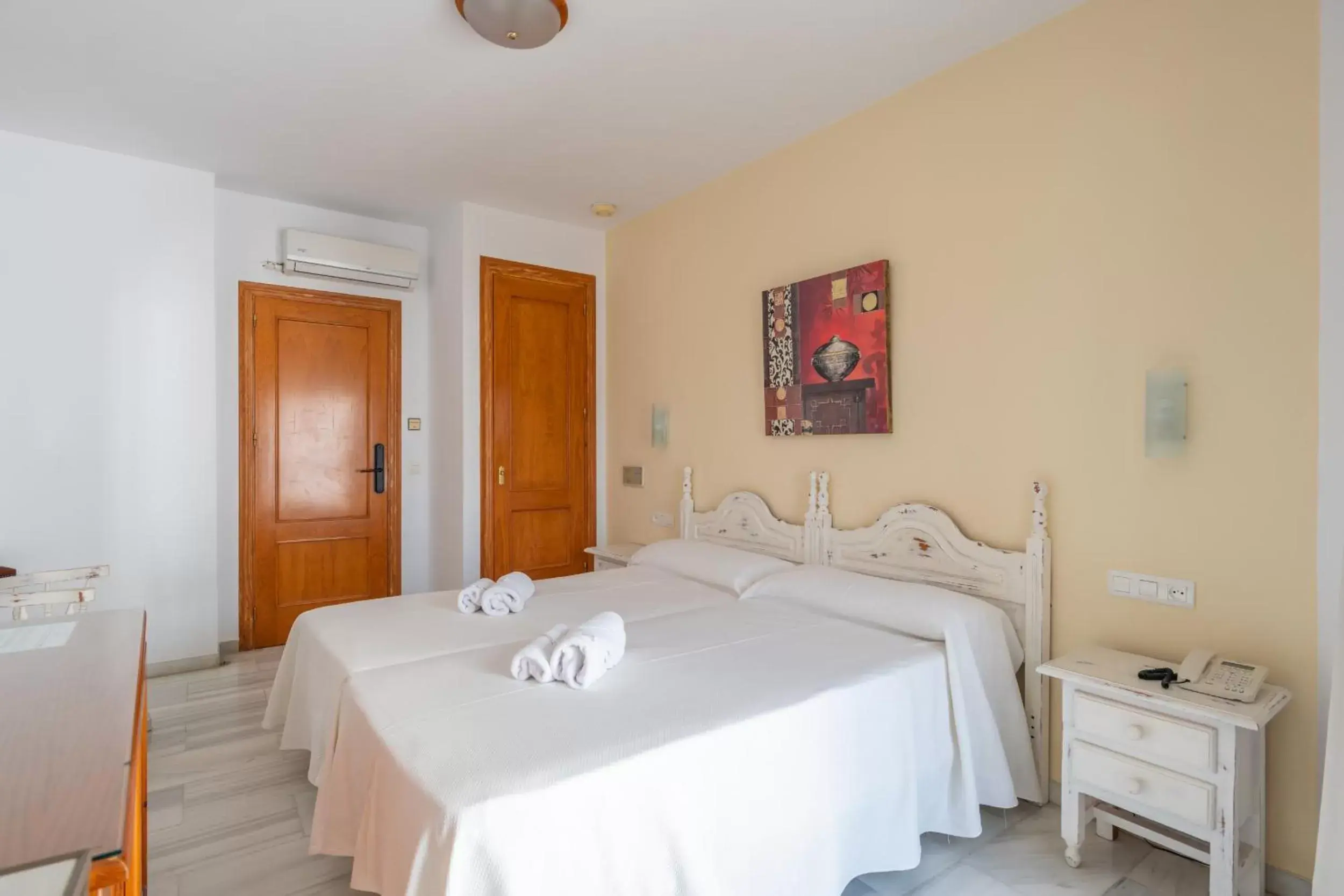 Bed in Apartahotel Playamaro by Dorobe Bed in Apartahotel Playamaro by Dorobe