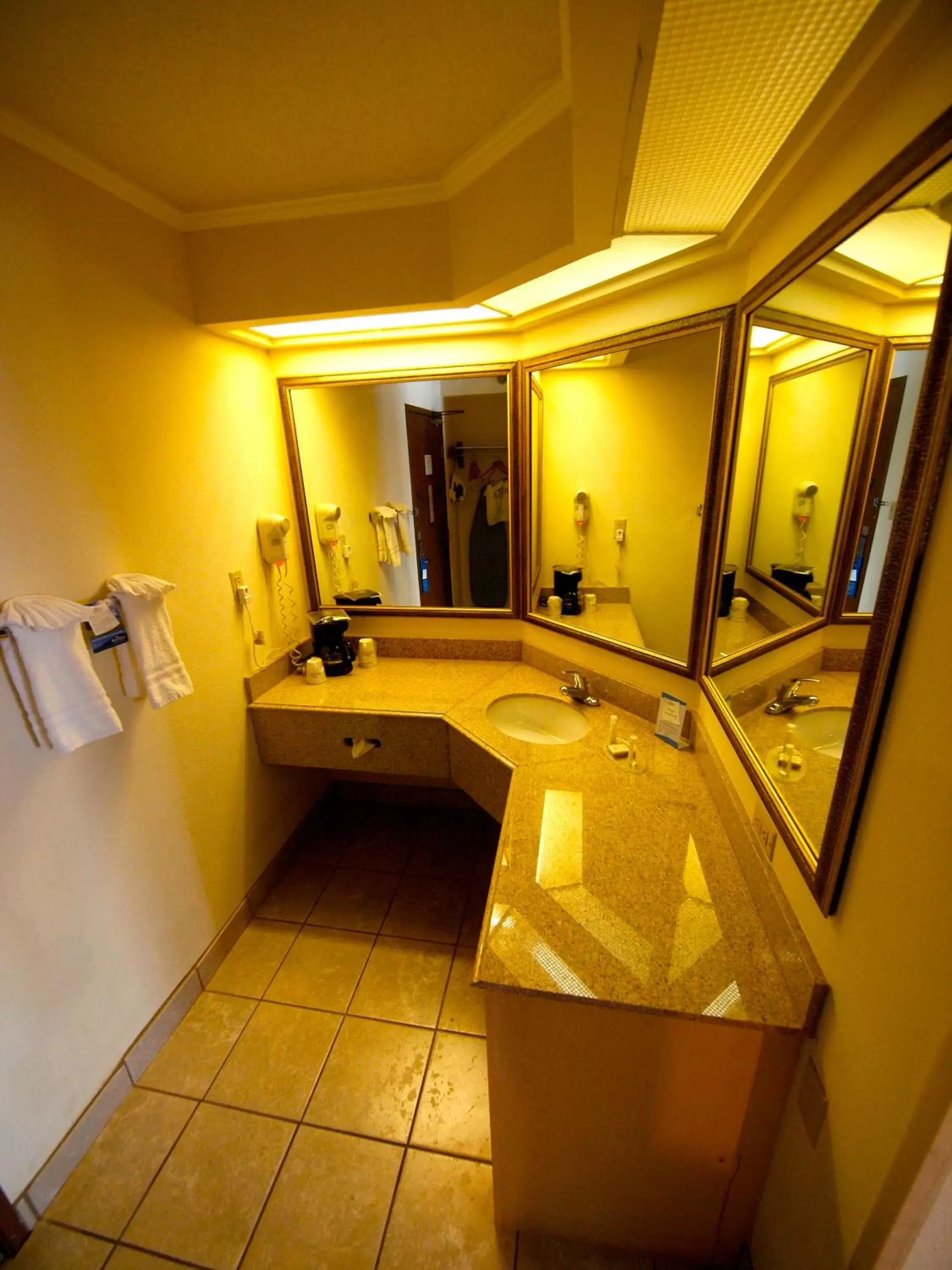 Bathroom in Days Inn & Suites by Wyndham Kansas City - Royals Stadium