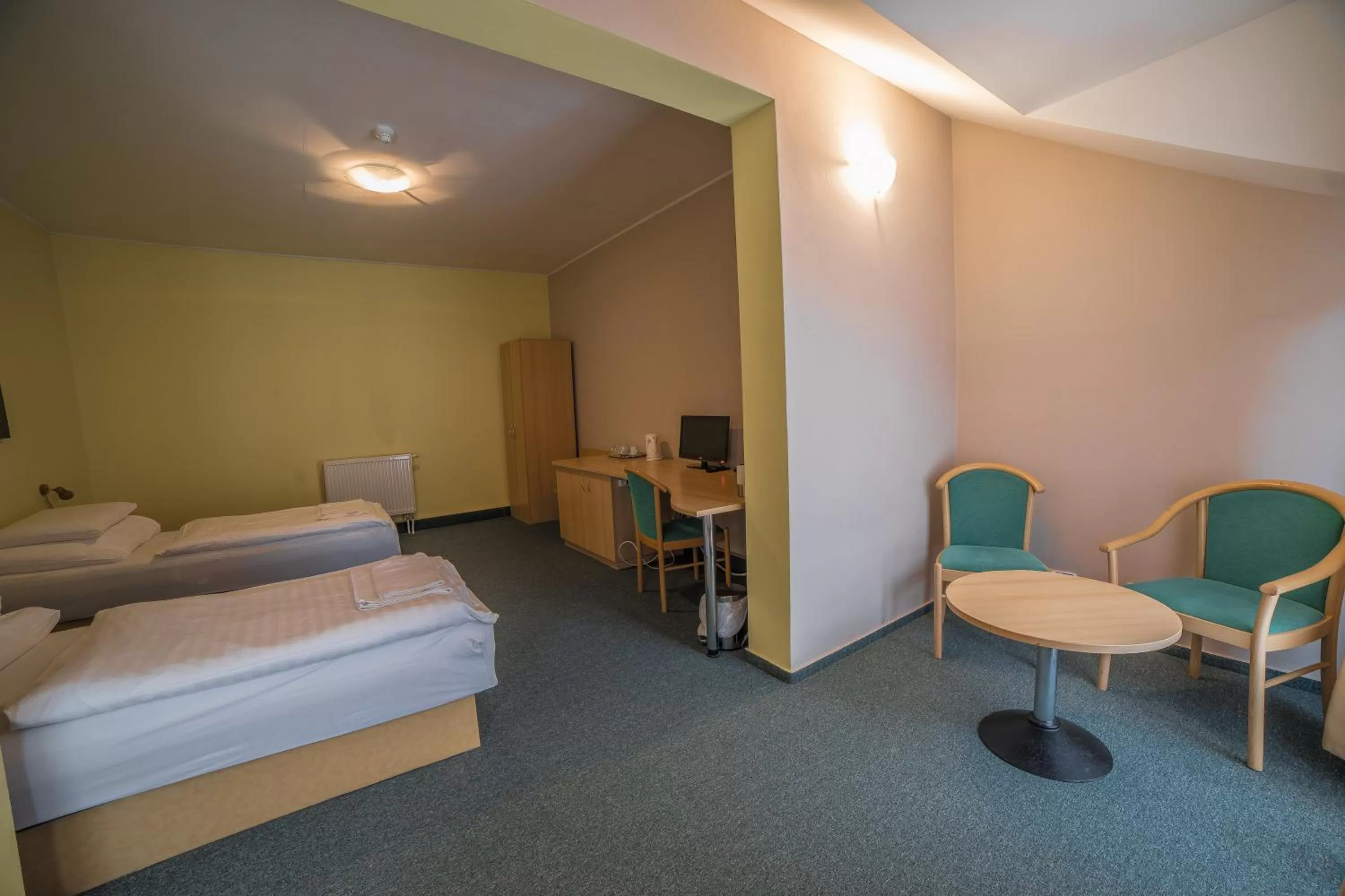 Bed in TeleDom Hotel