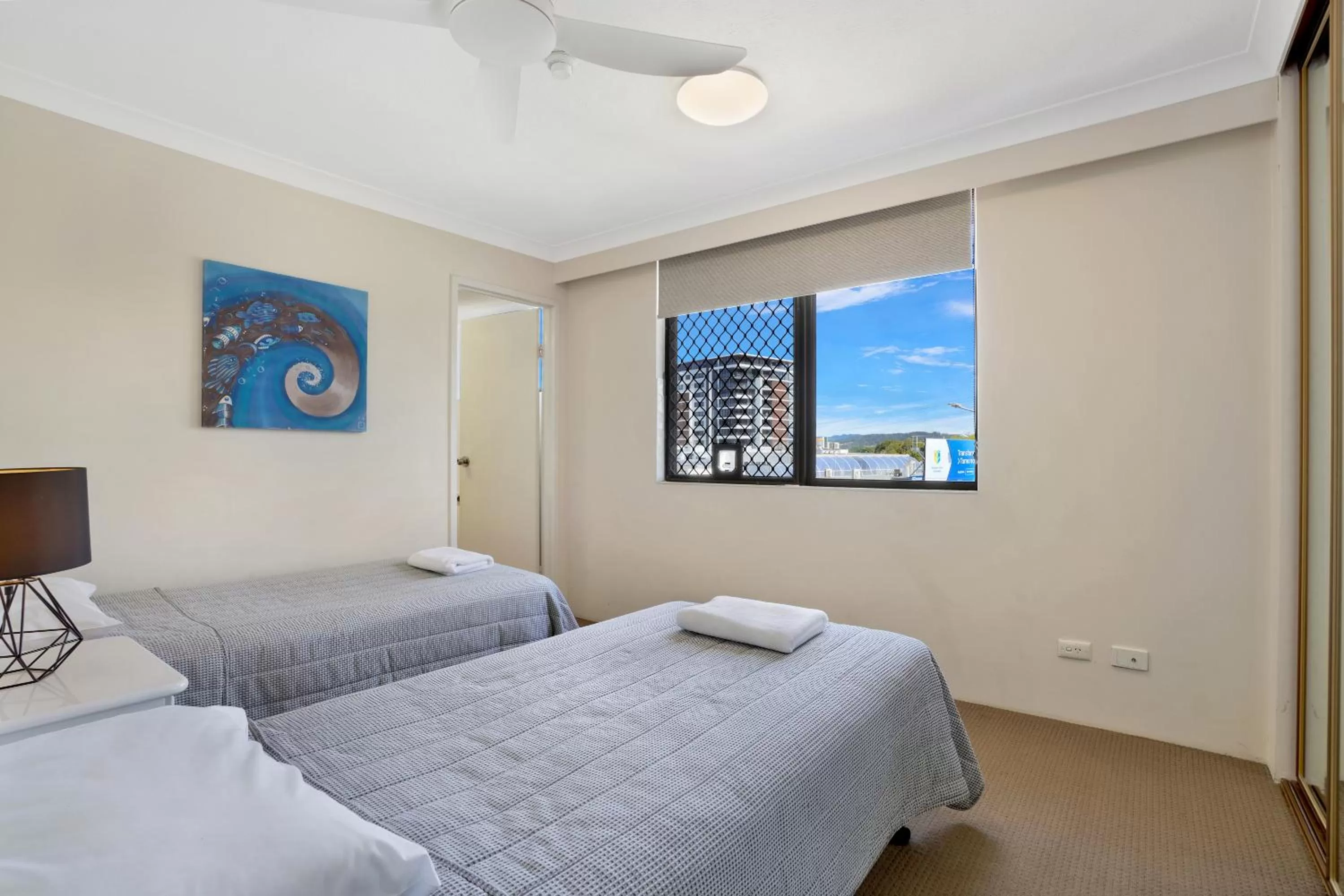 Bed in Beach Palms Holiday Apartments