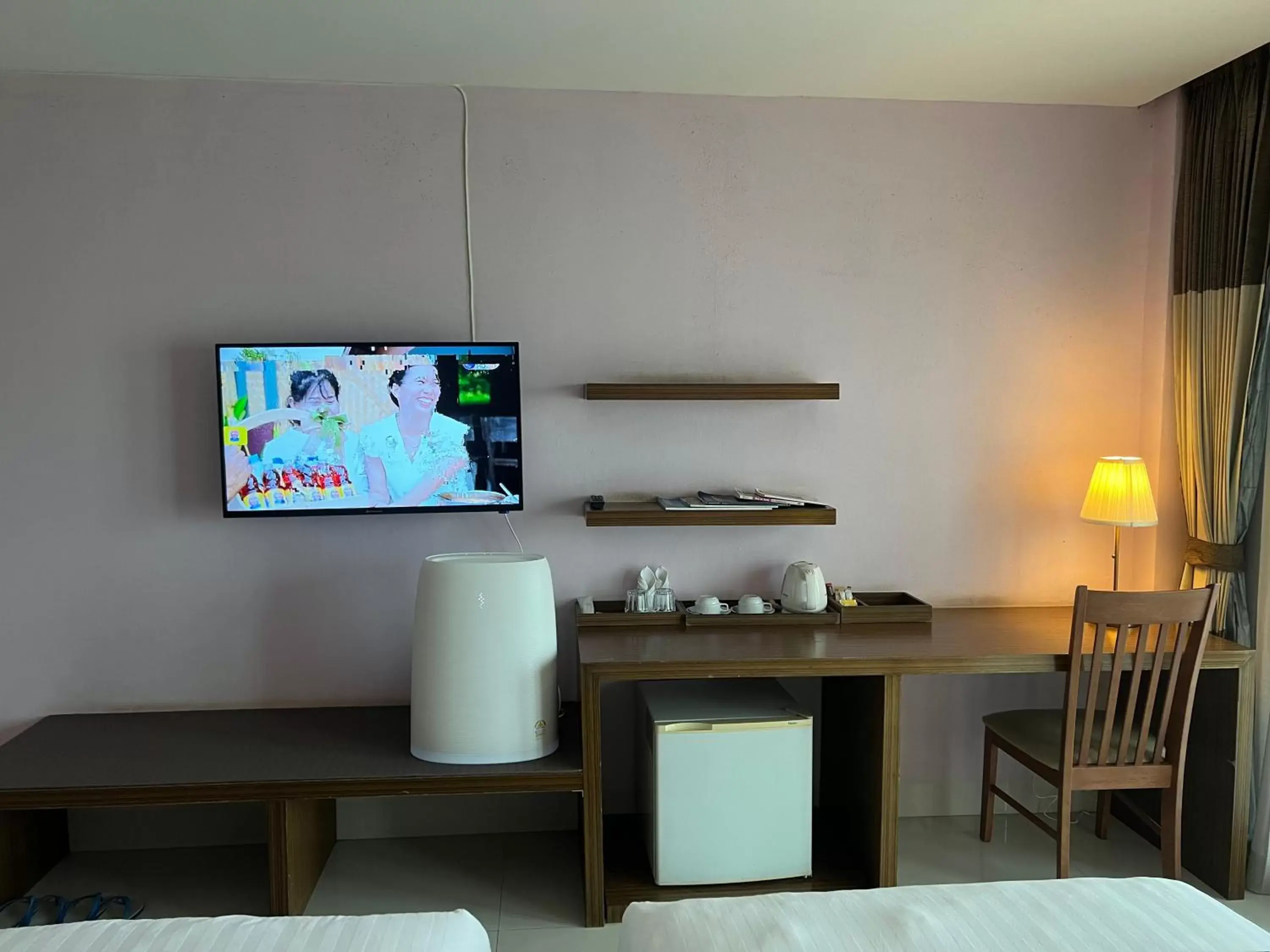 TV/Entertainment Center in Siam Triangle Hotel