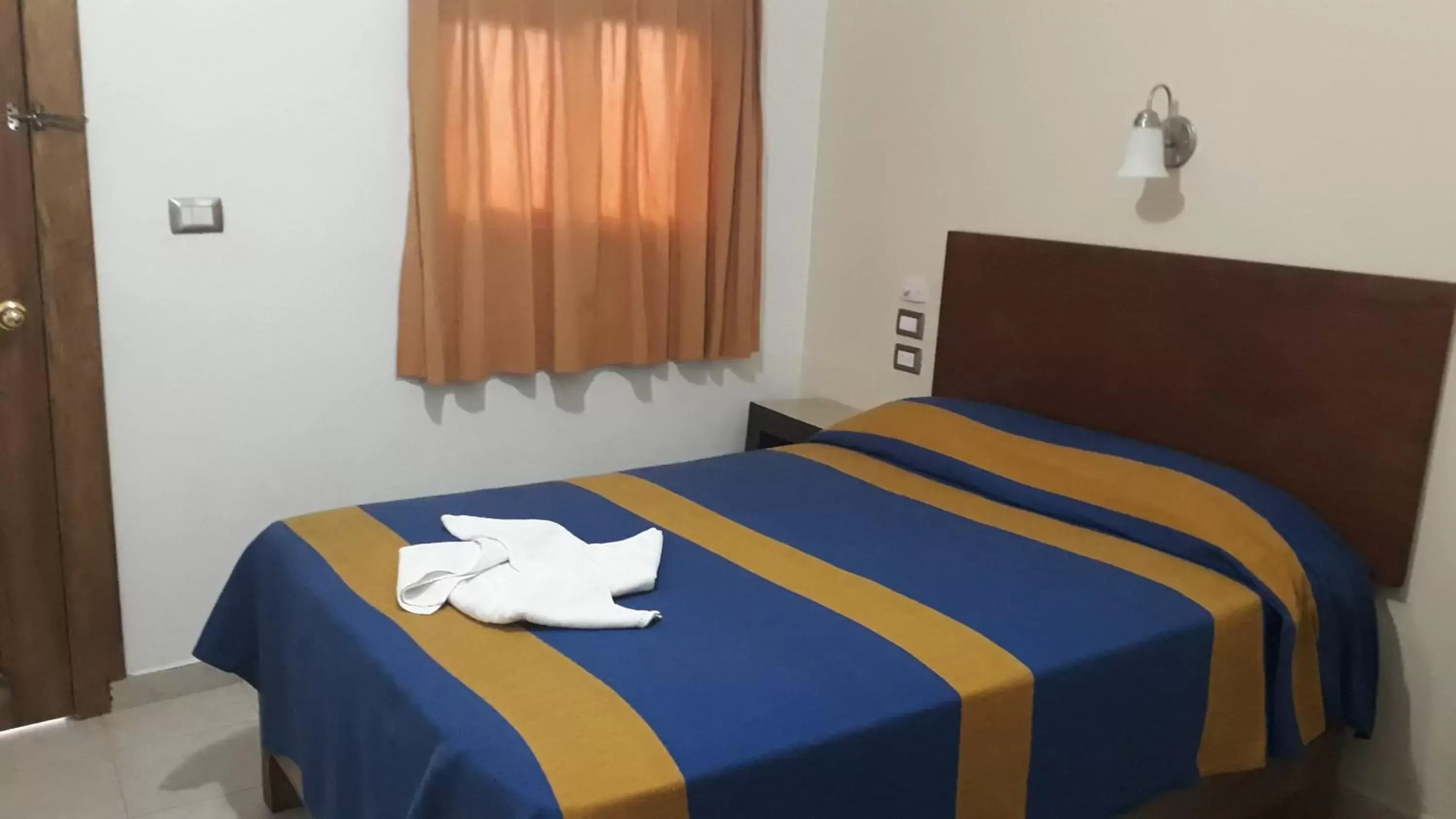 Bed in Hotel Cervantino