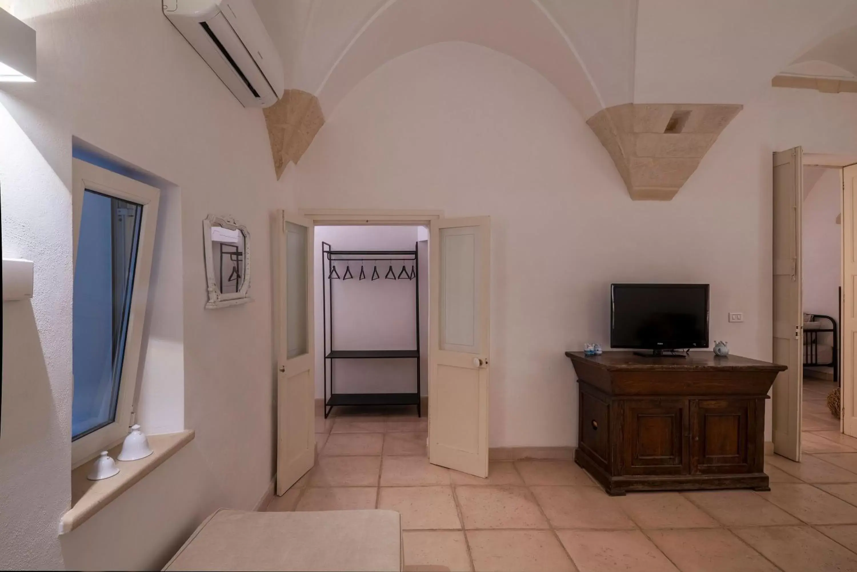 TV/Entertainment Center in B&B Corte Dei Romiti - Suites & Apartments SIT