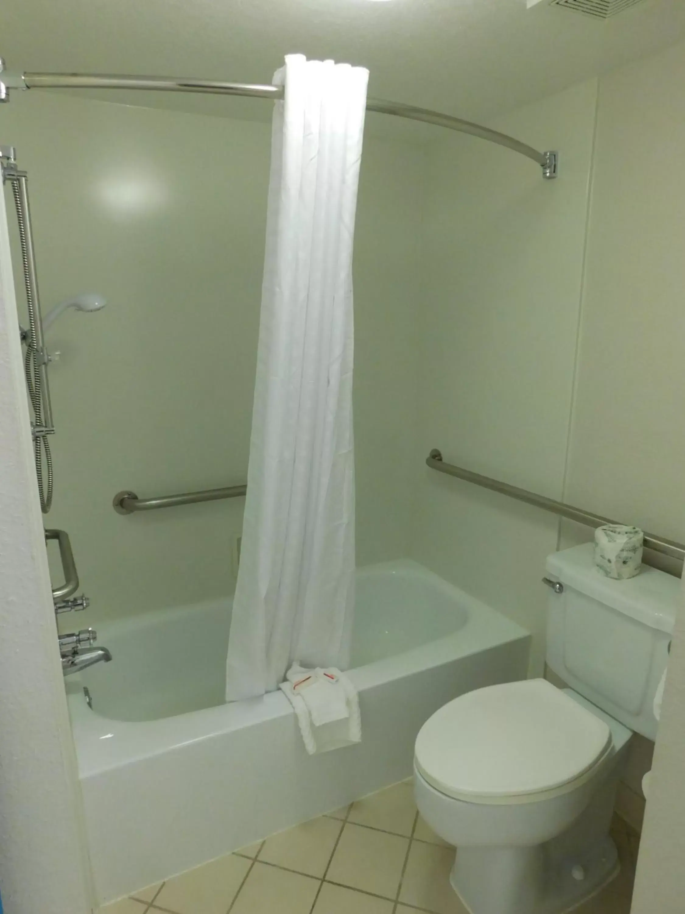 Bathroom in Days Inn & Suites by Wyndham Schaumburg- Woodfield Mall