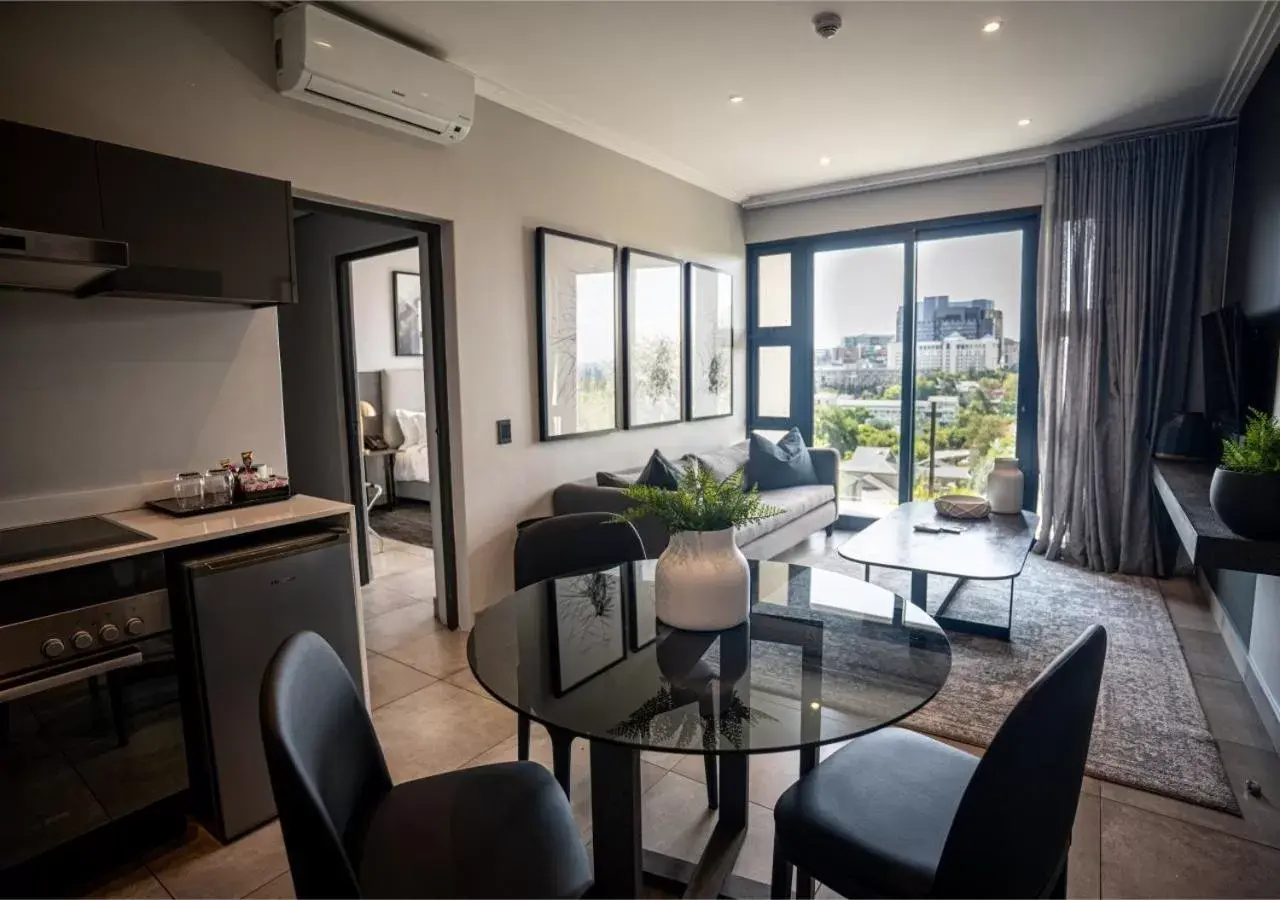 Living room, Kitchen/Kitchenette in The Catalyst Apartment Hotel by NEWMARK