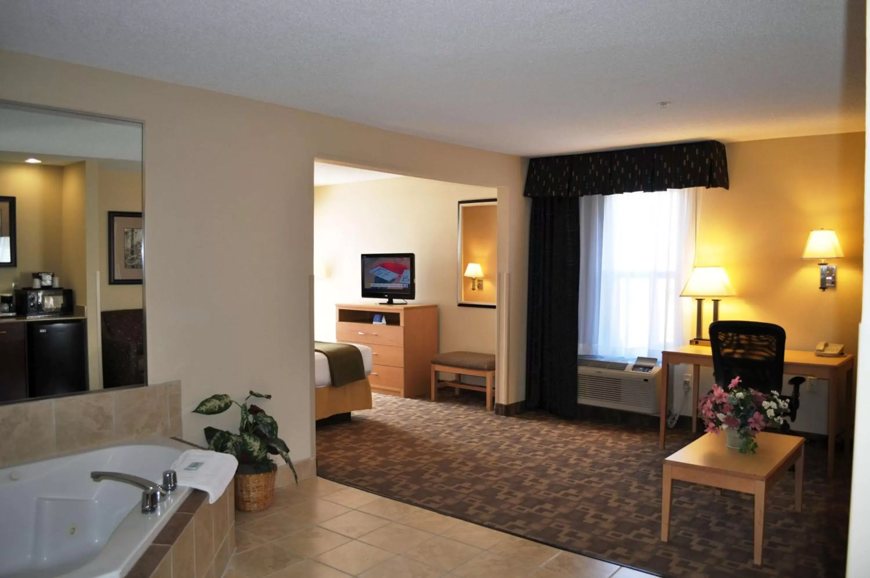 Photo of the whole room in SureStay Plus Hotel by Best Western Roanoke Rapids I-95