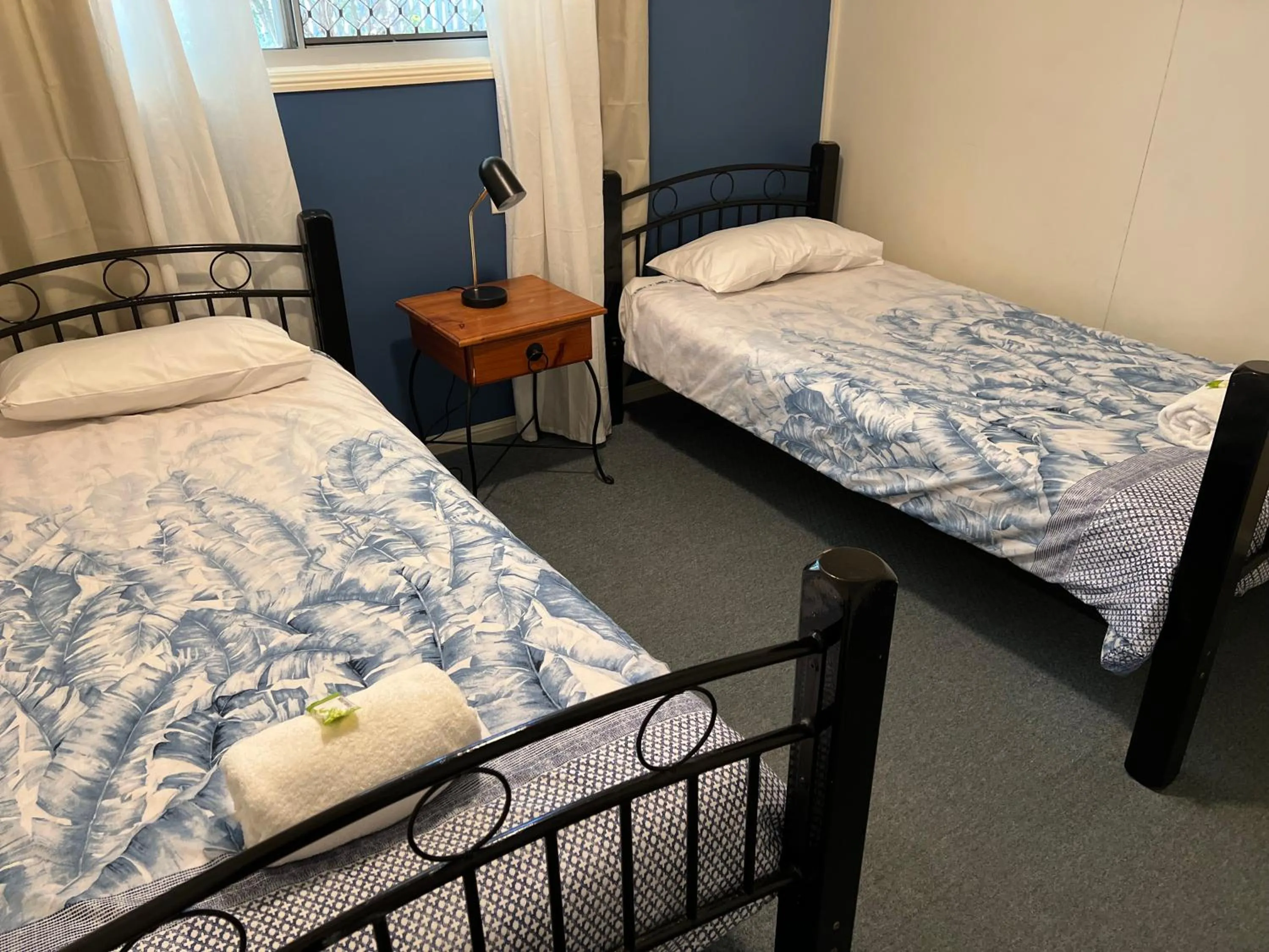 Bed in Colonial Village Resort