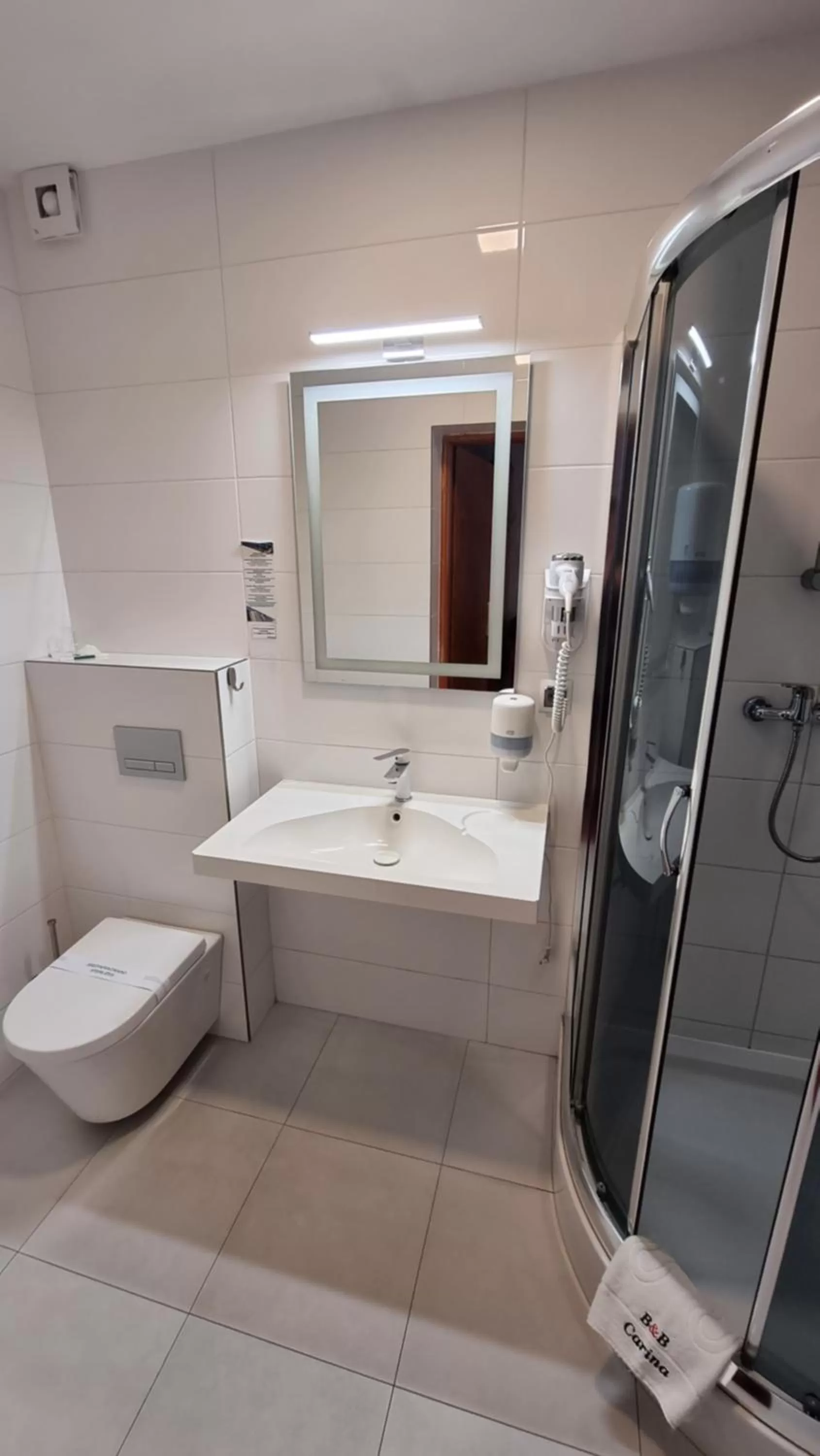 Bathroom in Carina Hotel