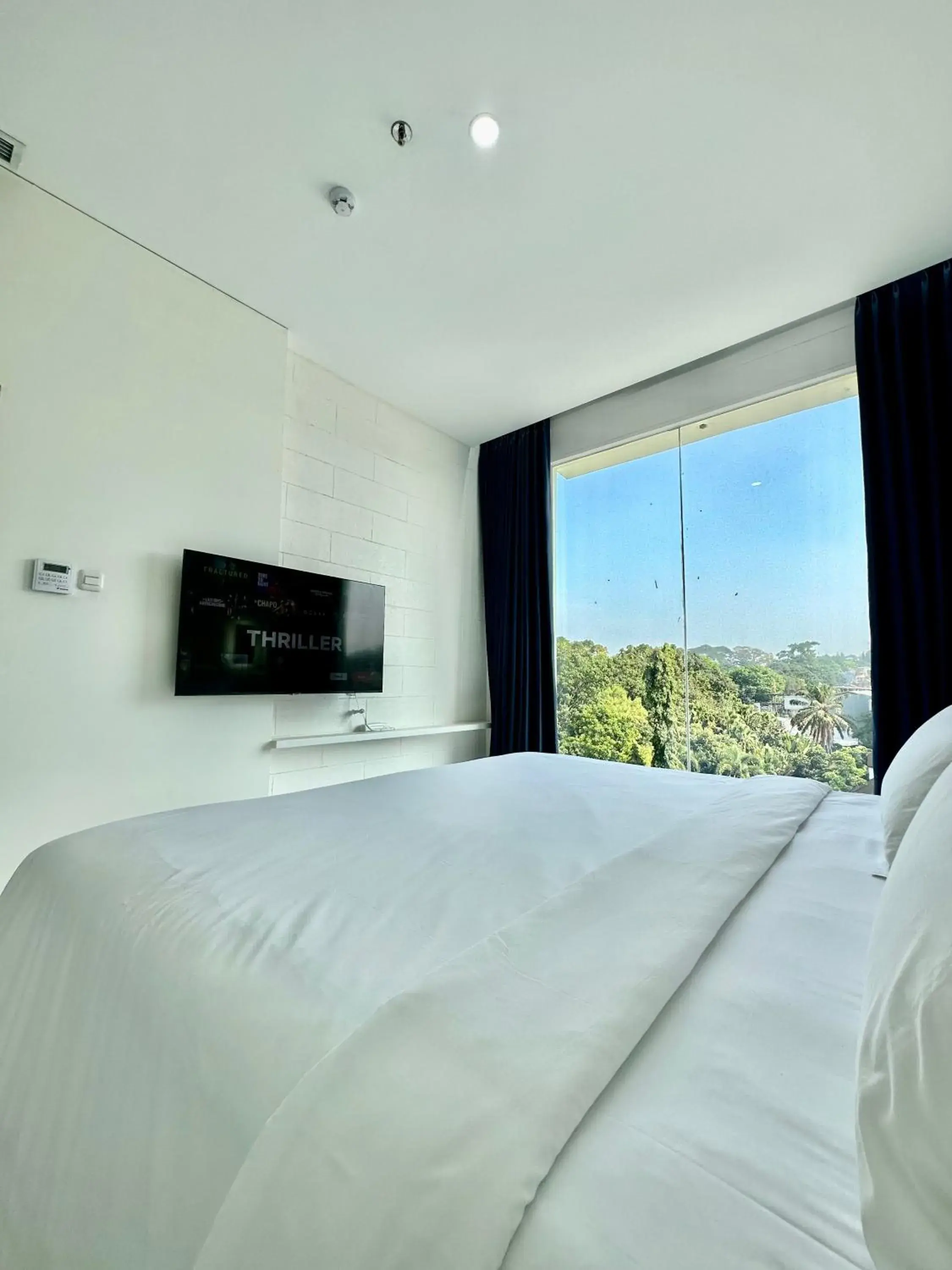 View (from property/room), Bed in Hemangini Hotel Bandung