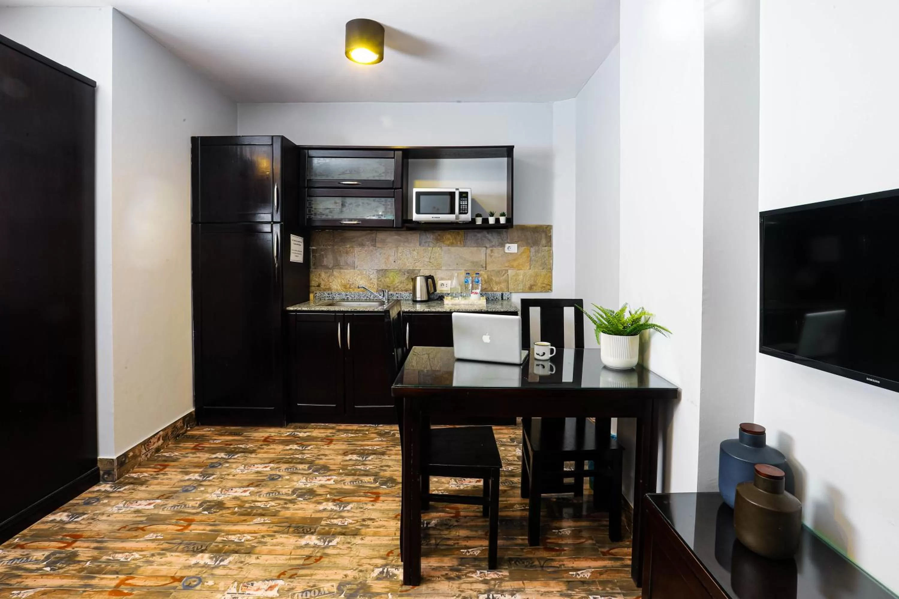 Kitchen or kitchenette in NewCity Hotel & Suites