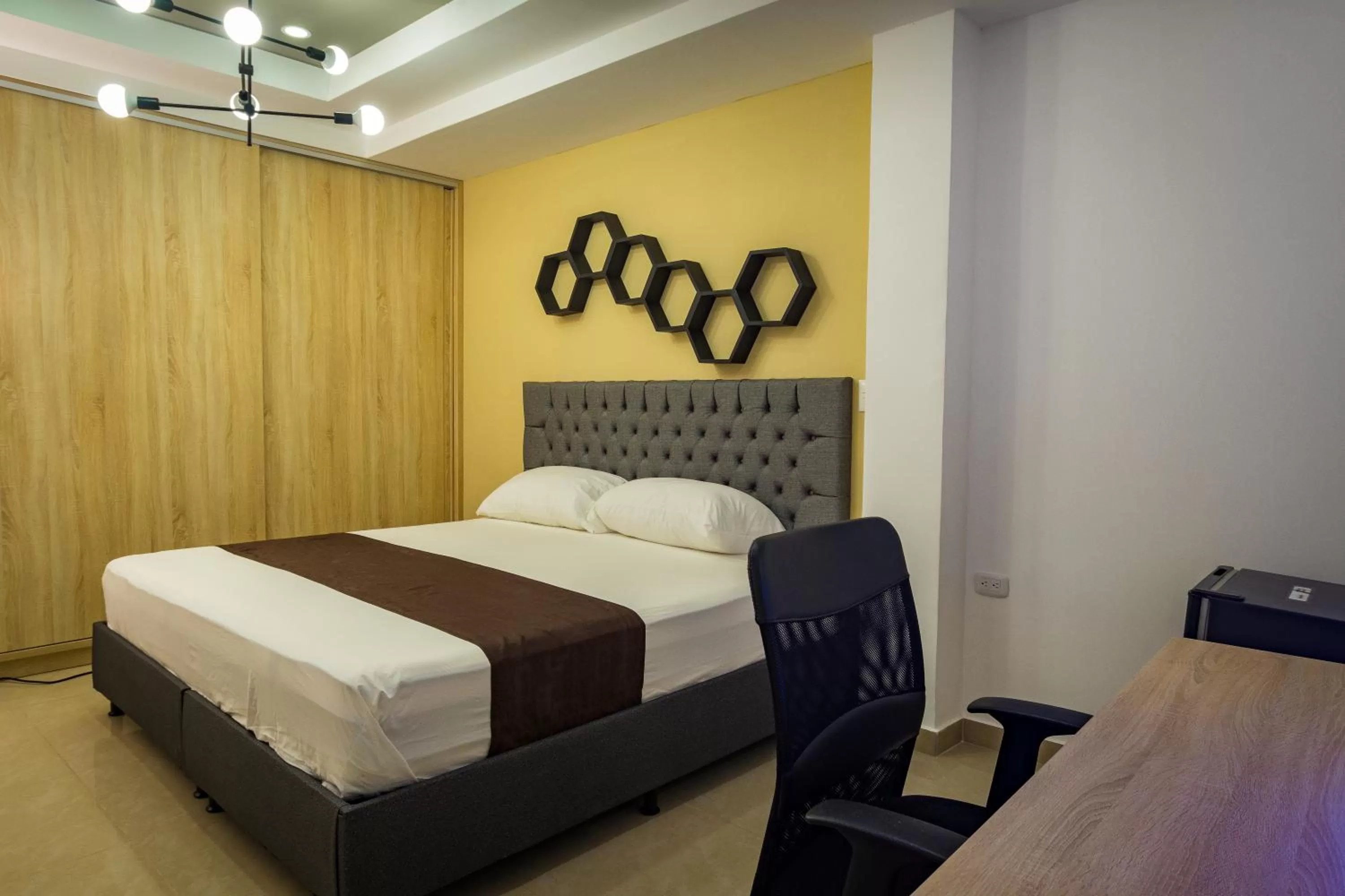 Bed in Genesis Hotel