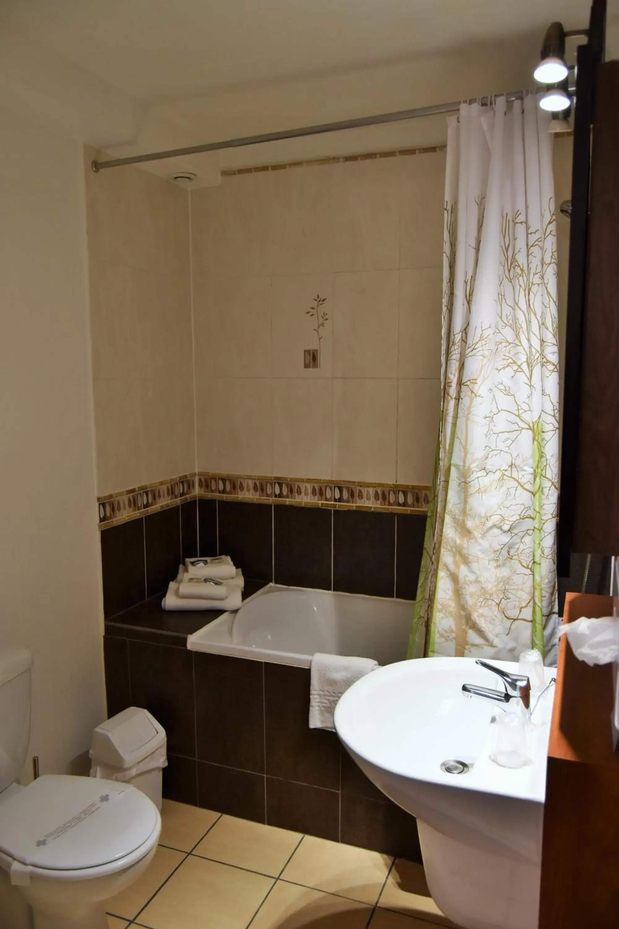 Bathroom in Kyriad Hotel - Restaurant Carentan