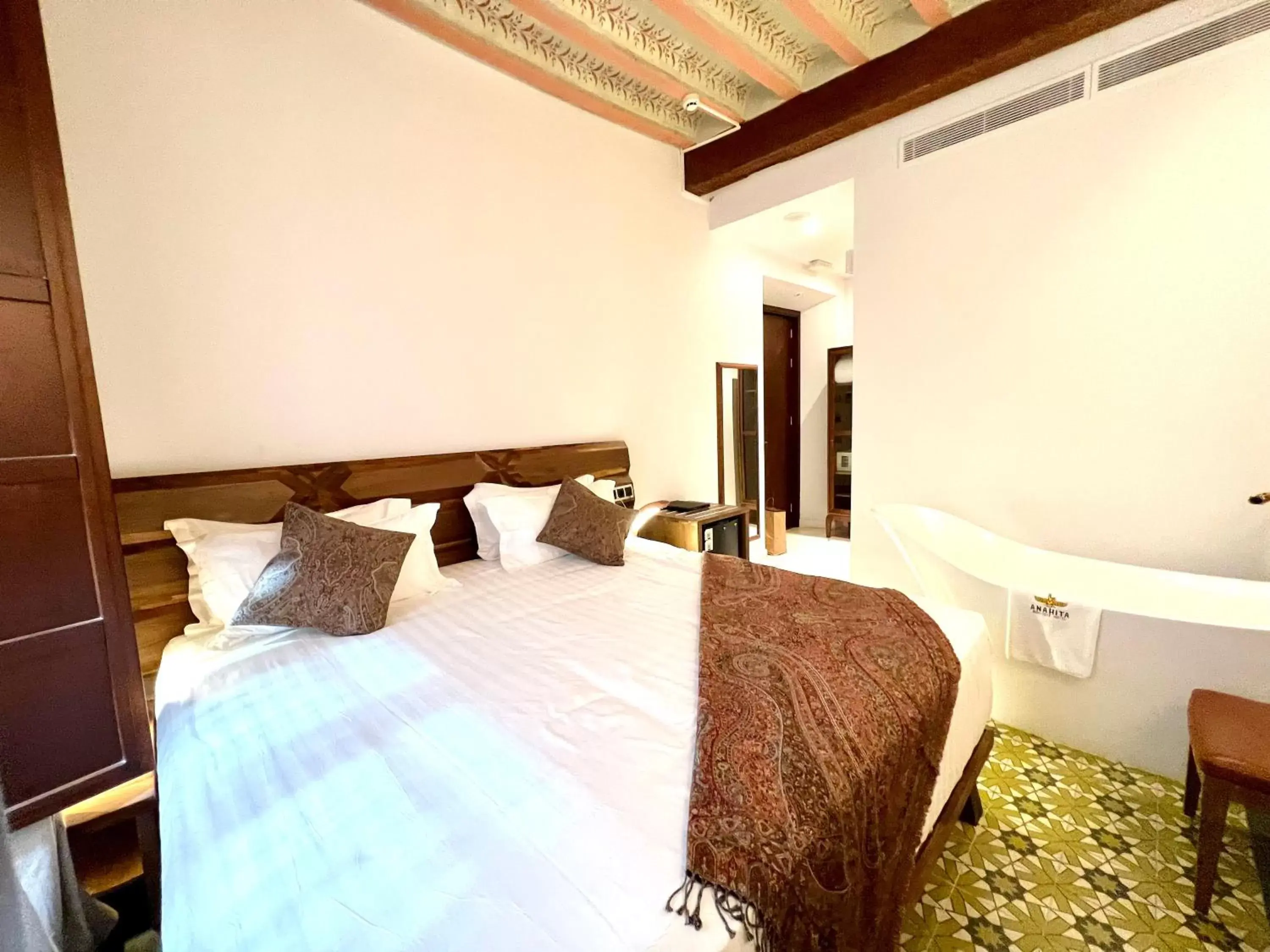 Bed in Anahita Boutique Hotel