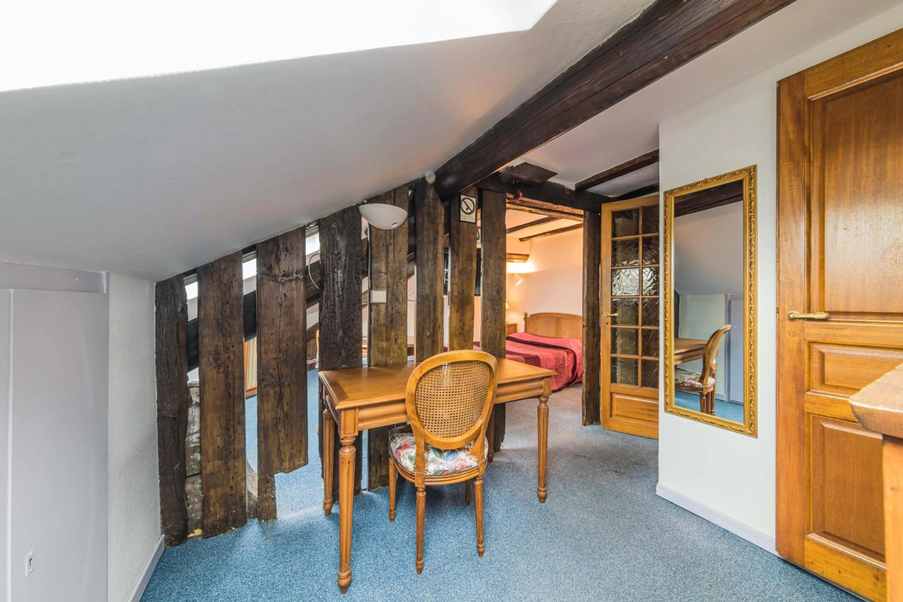 Bedroom in Hôtel du Centre