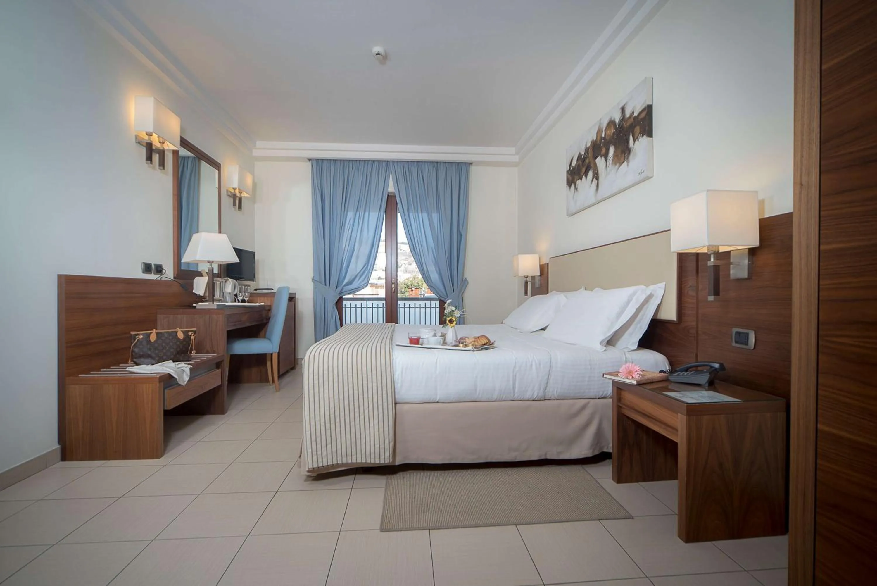 Bed in Suites & Residence Hotel