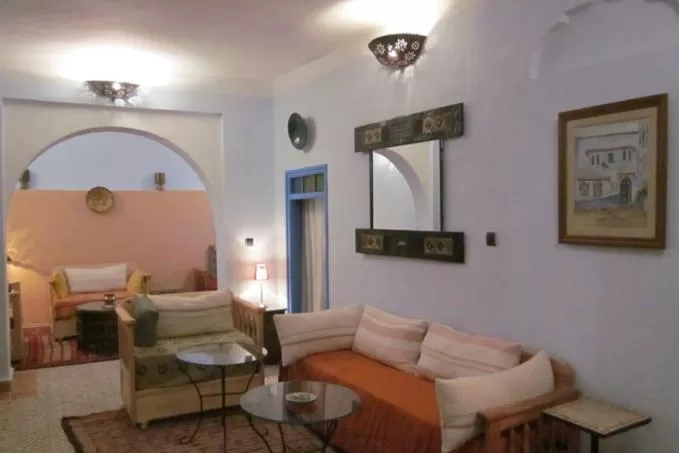 Communal lounge/ TV room, Bed in Hôtel Ras El Maa