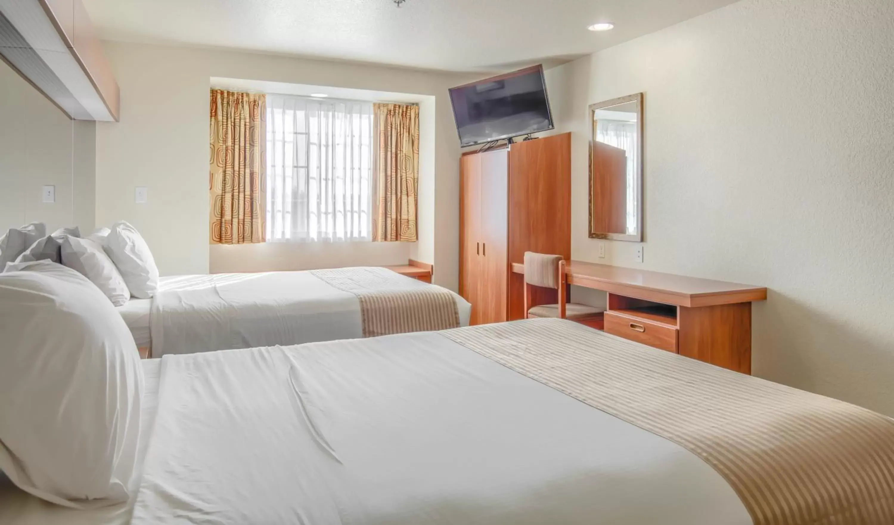 Bed in Microtel Inn & Suites by Wyndham Gulf Shores